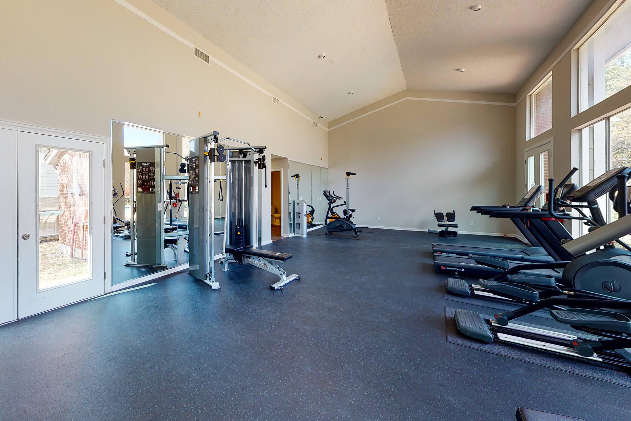 a room filled with furniture and a large window