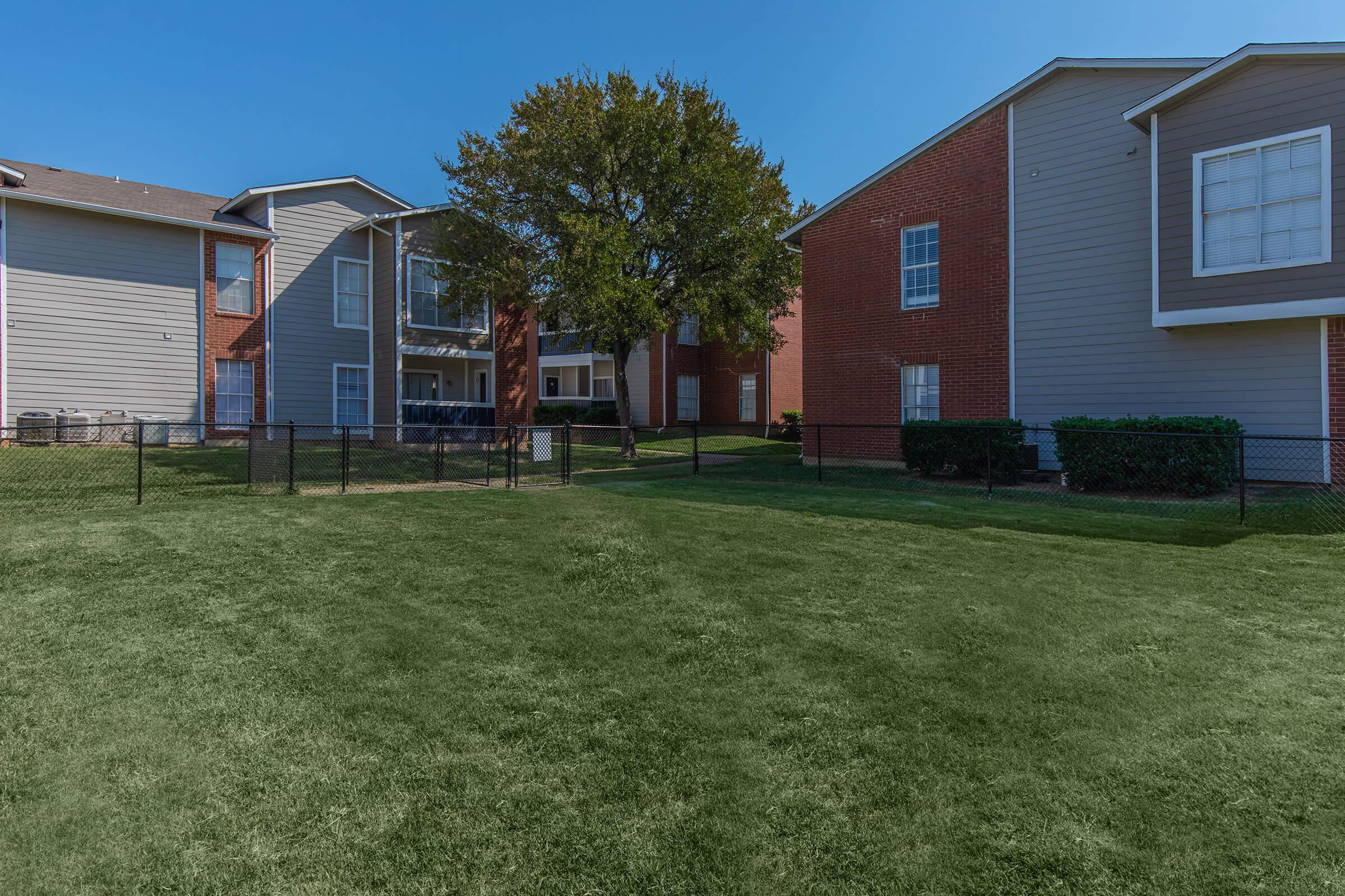 a large lawn in front of a house