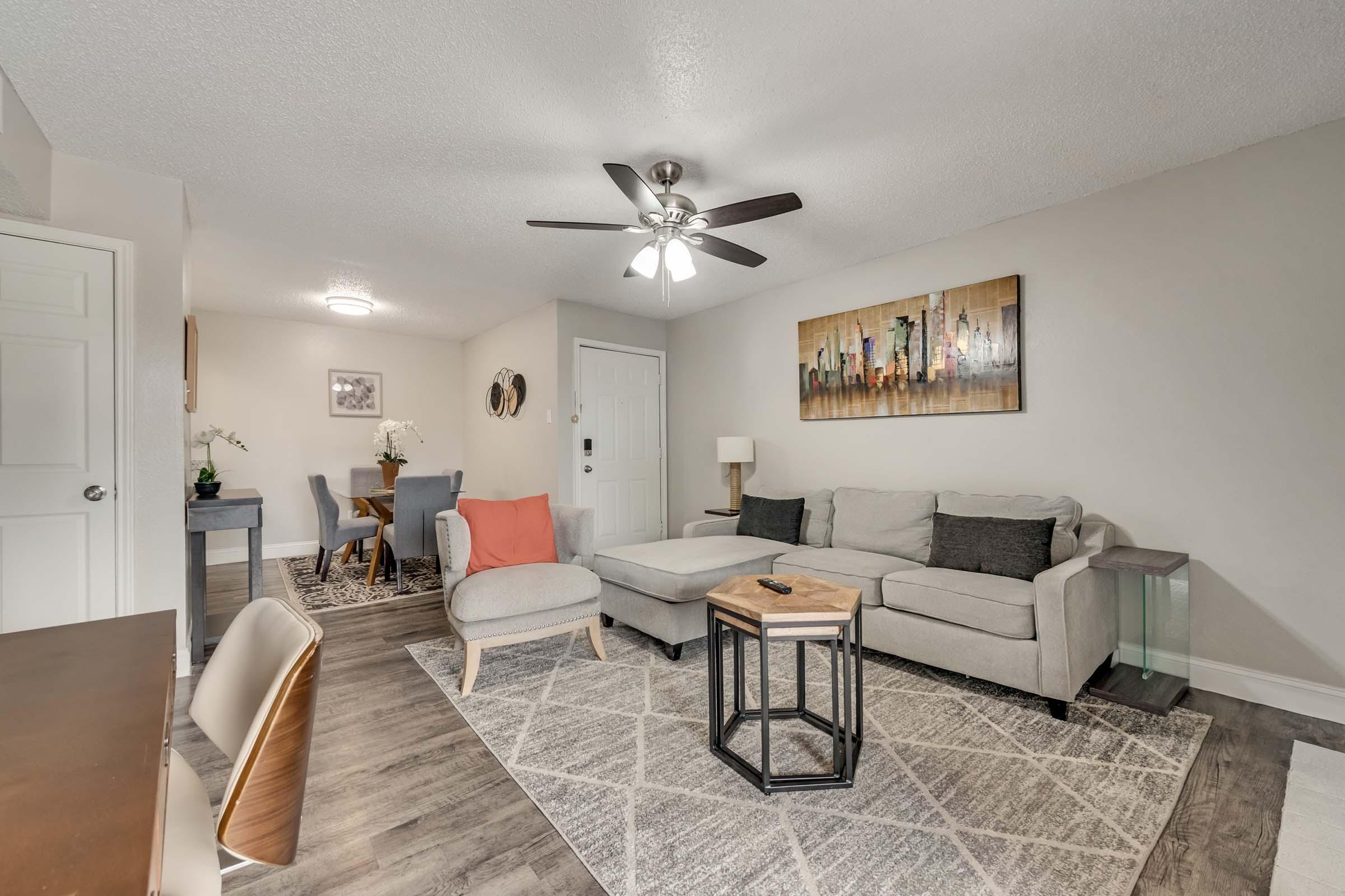 a living room filled with lots of furniture