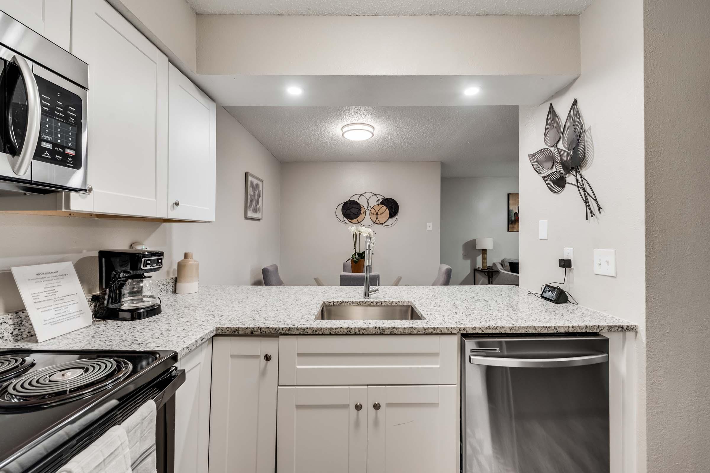 a kitchen with a stove and a sink