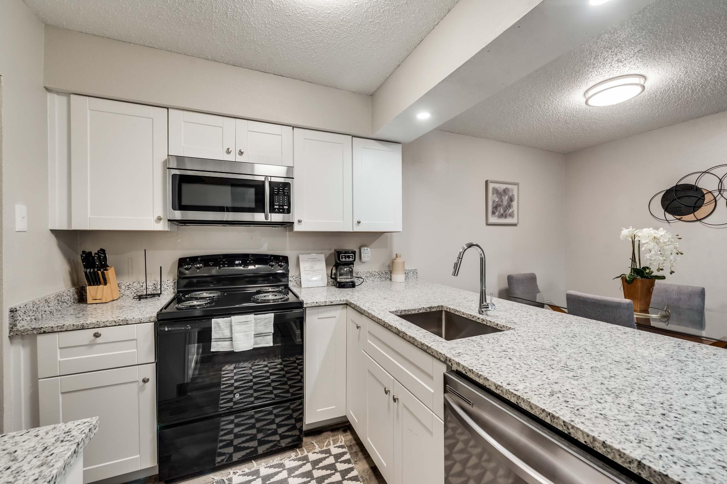 a kitchen with a stove and a sink