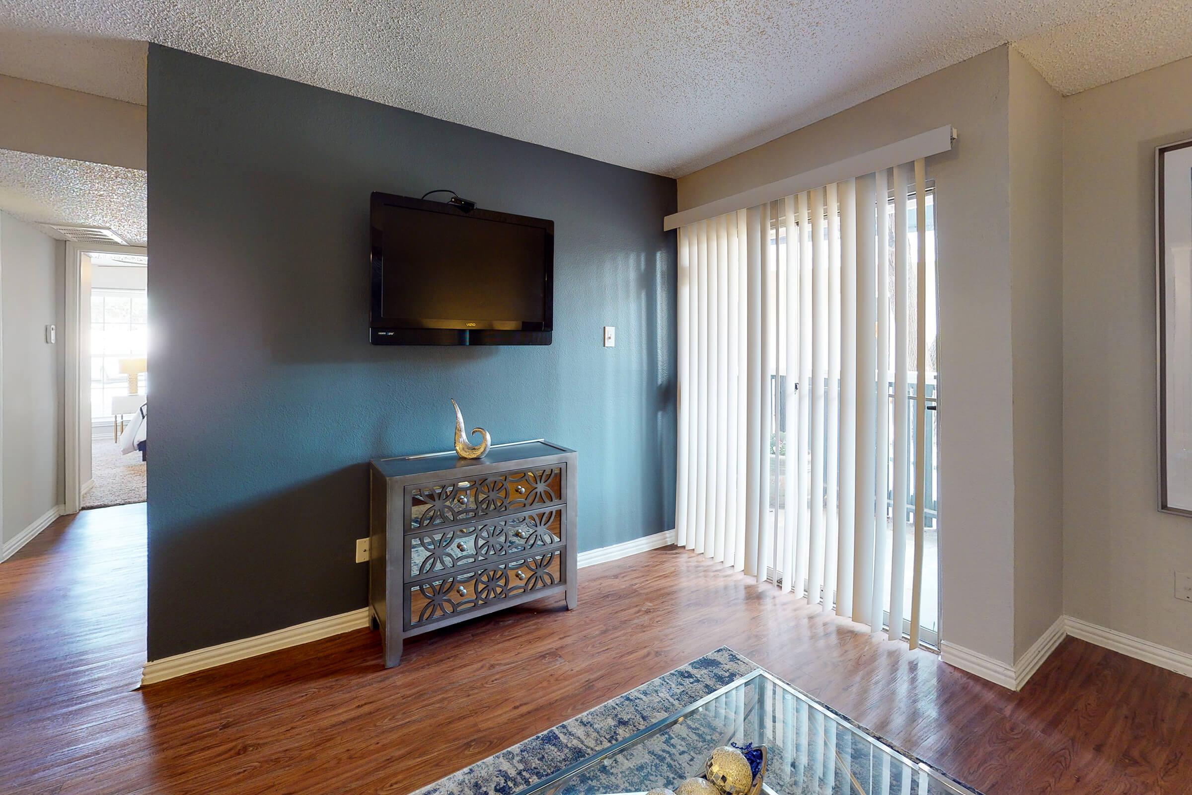 a view of a living room with a large window