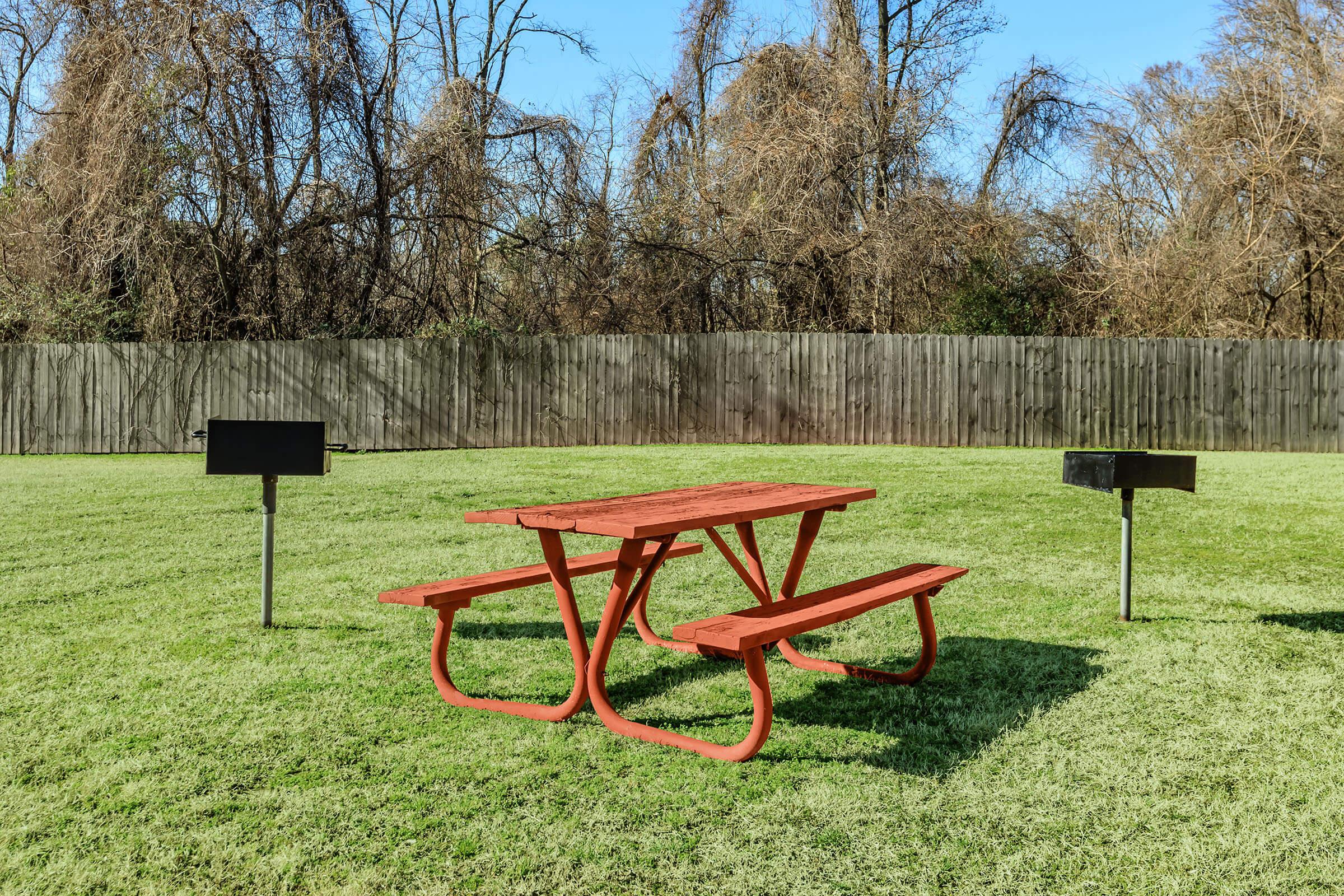 Northwood Park Apartment picnic table and two grills