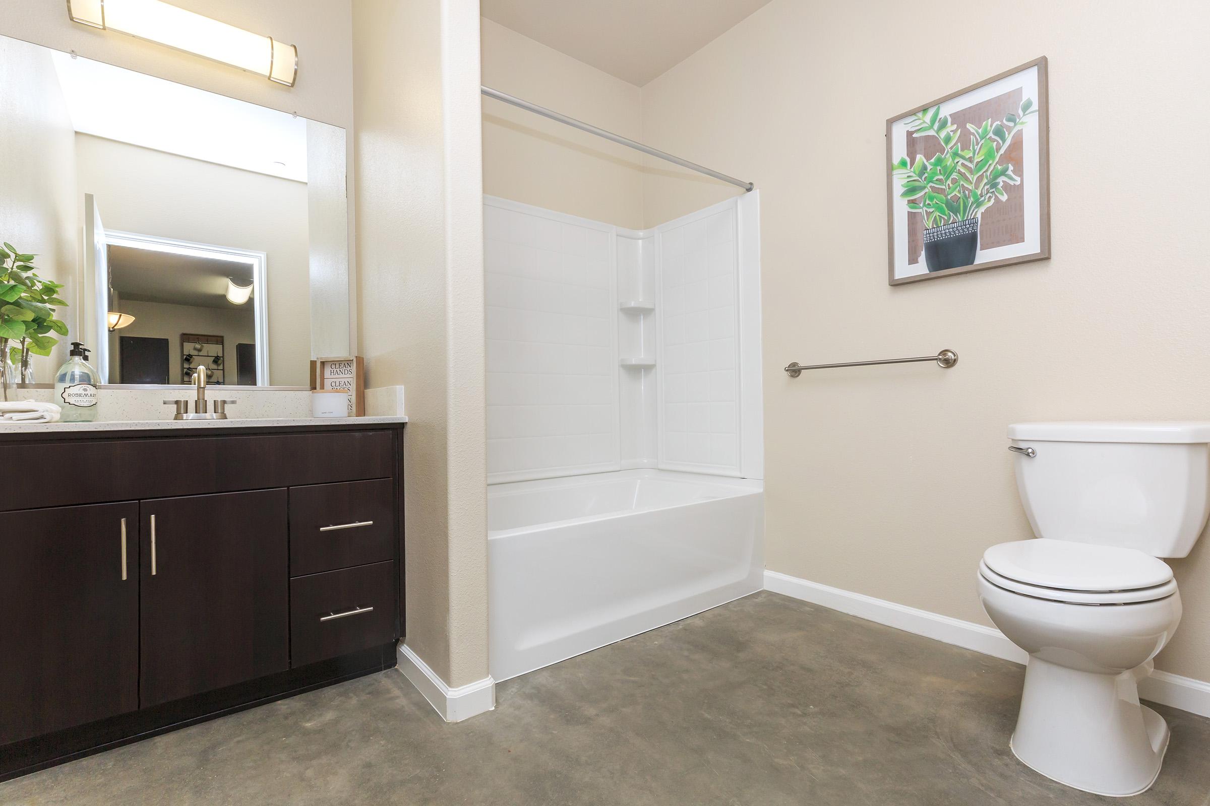a room with a sink and a mirror
