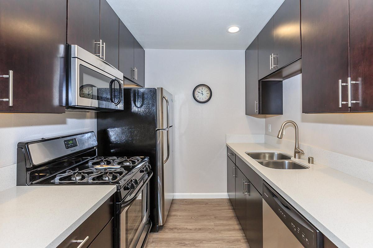 a modern kitchen with stainless steel appliances