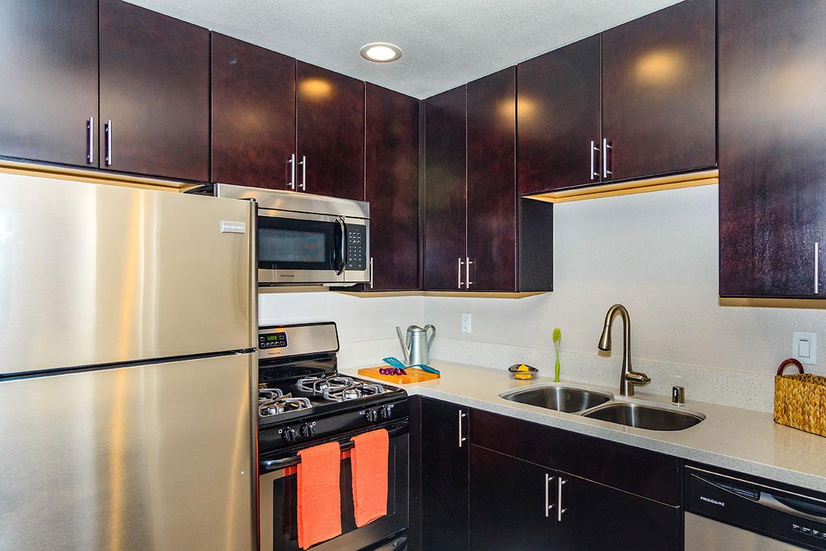 a modern kitchen with stainless steel appliances