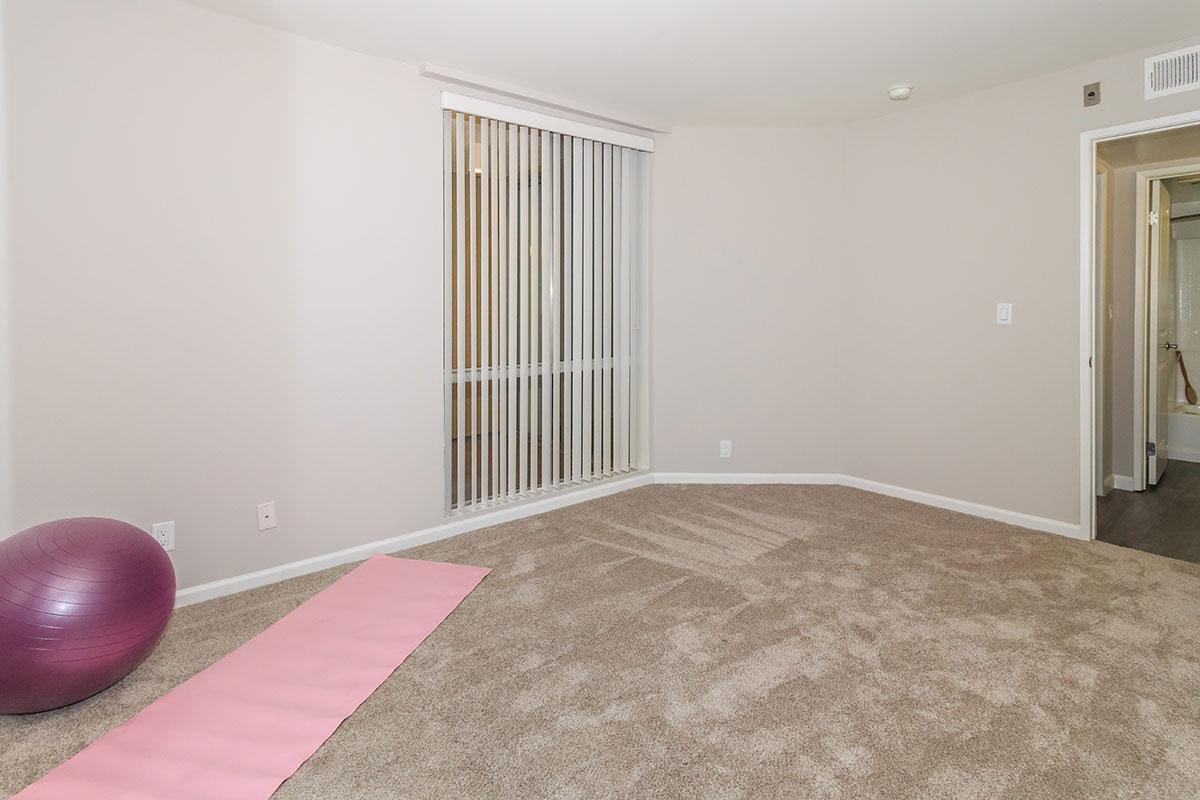 a bedroom with a bed in a room