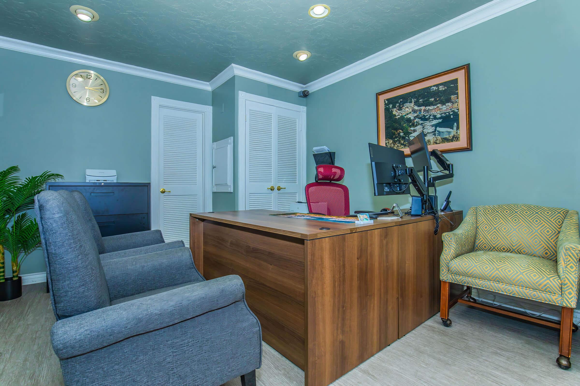 a living room filled with furniture and a tv