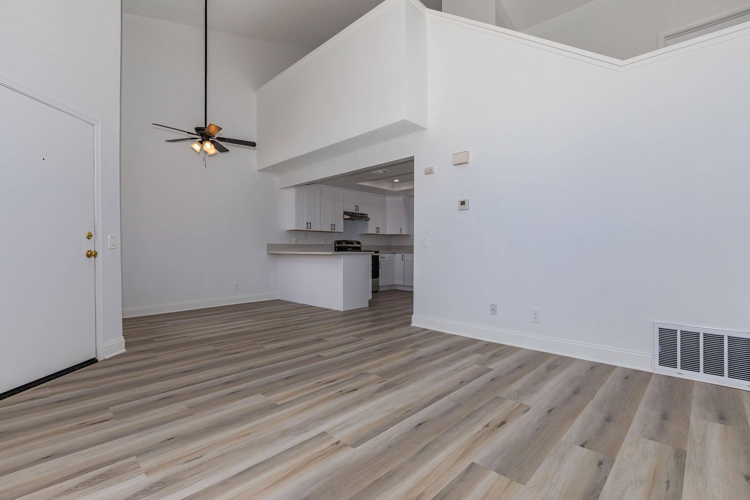 a bedroom with a wooden floor