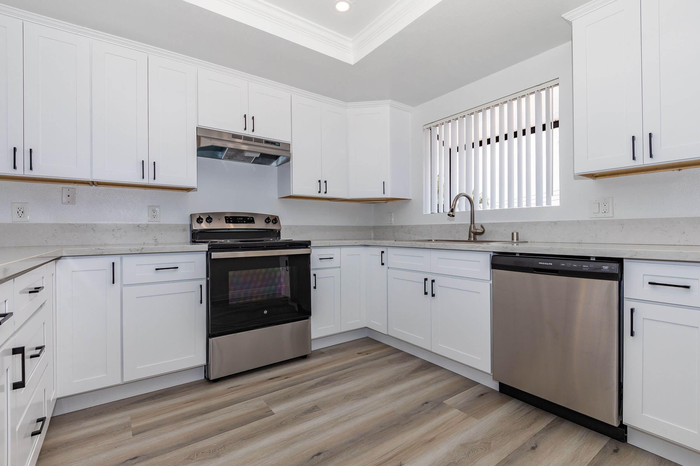 a kitchen with a stove and a refrigerator