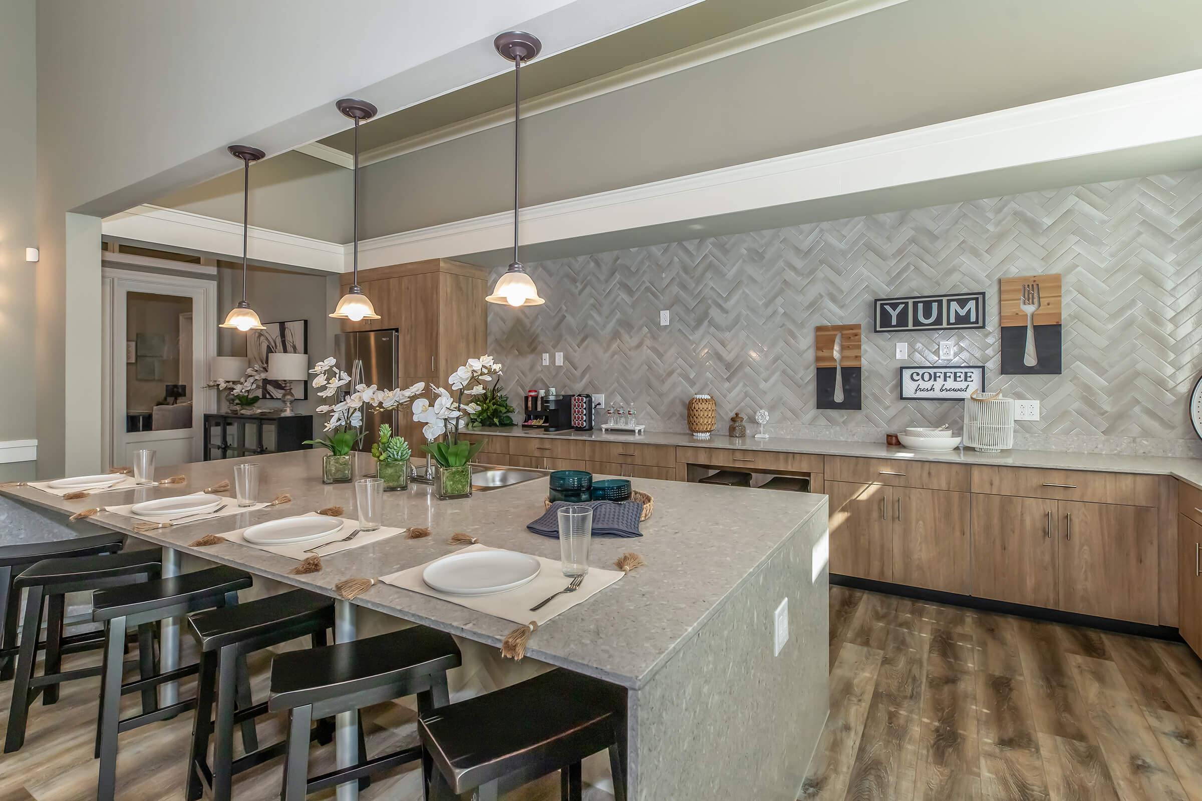 a kitchen with an island in the middle of a table