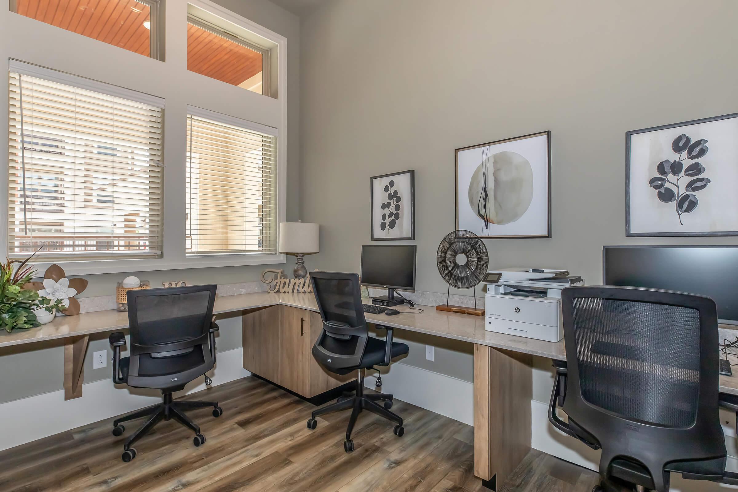 a room filled with furniture and a large window