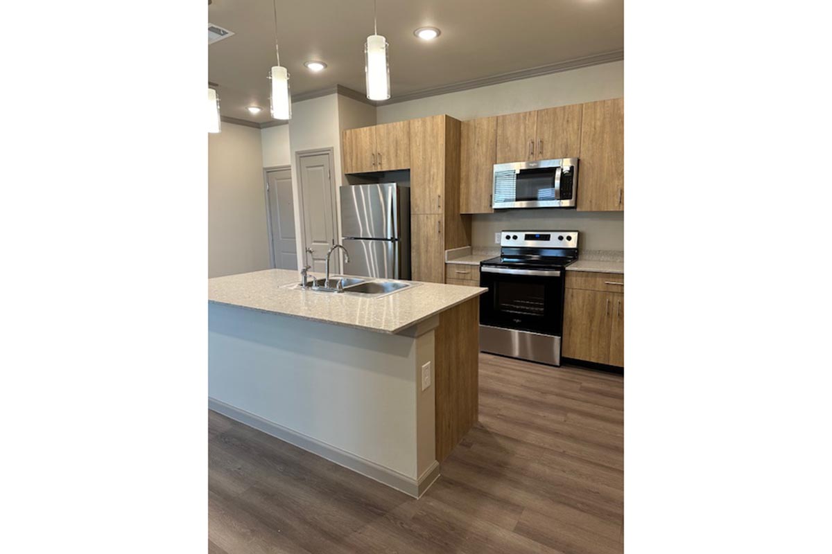 a modern kitchen with wood cabinets