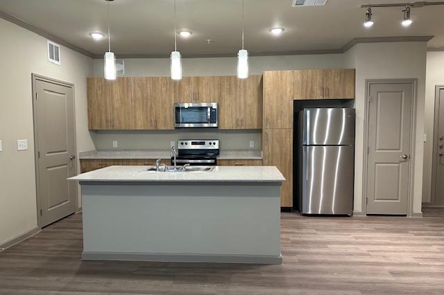 a kitchen with a stove sink and refrigerator