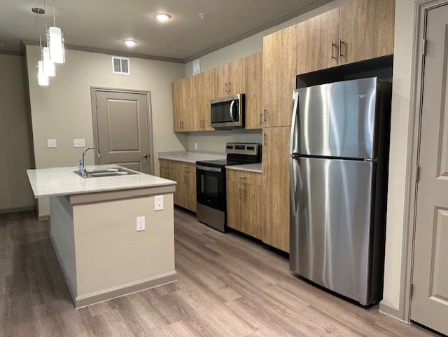 a modern kitchen with stainless steel appliances