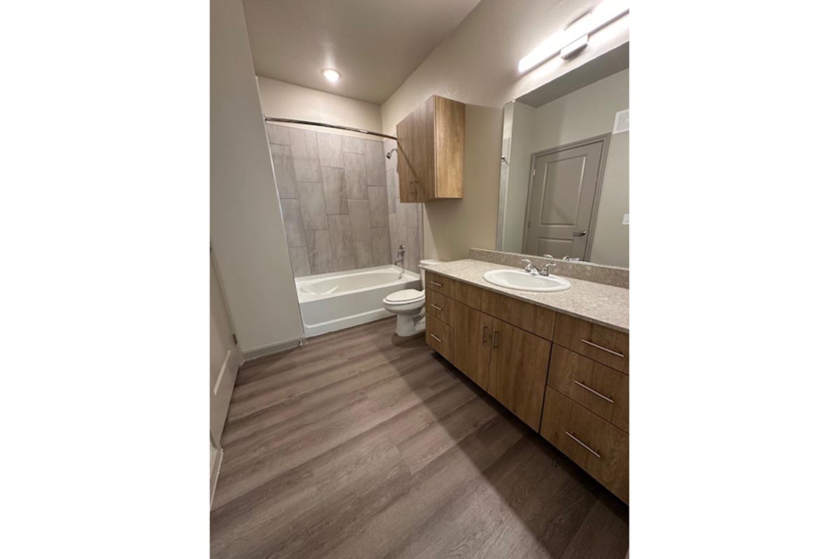 a kitchen with a wood floor