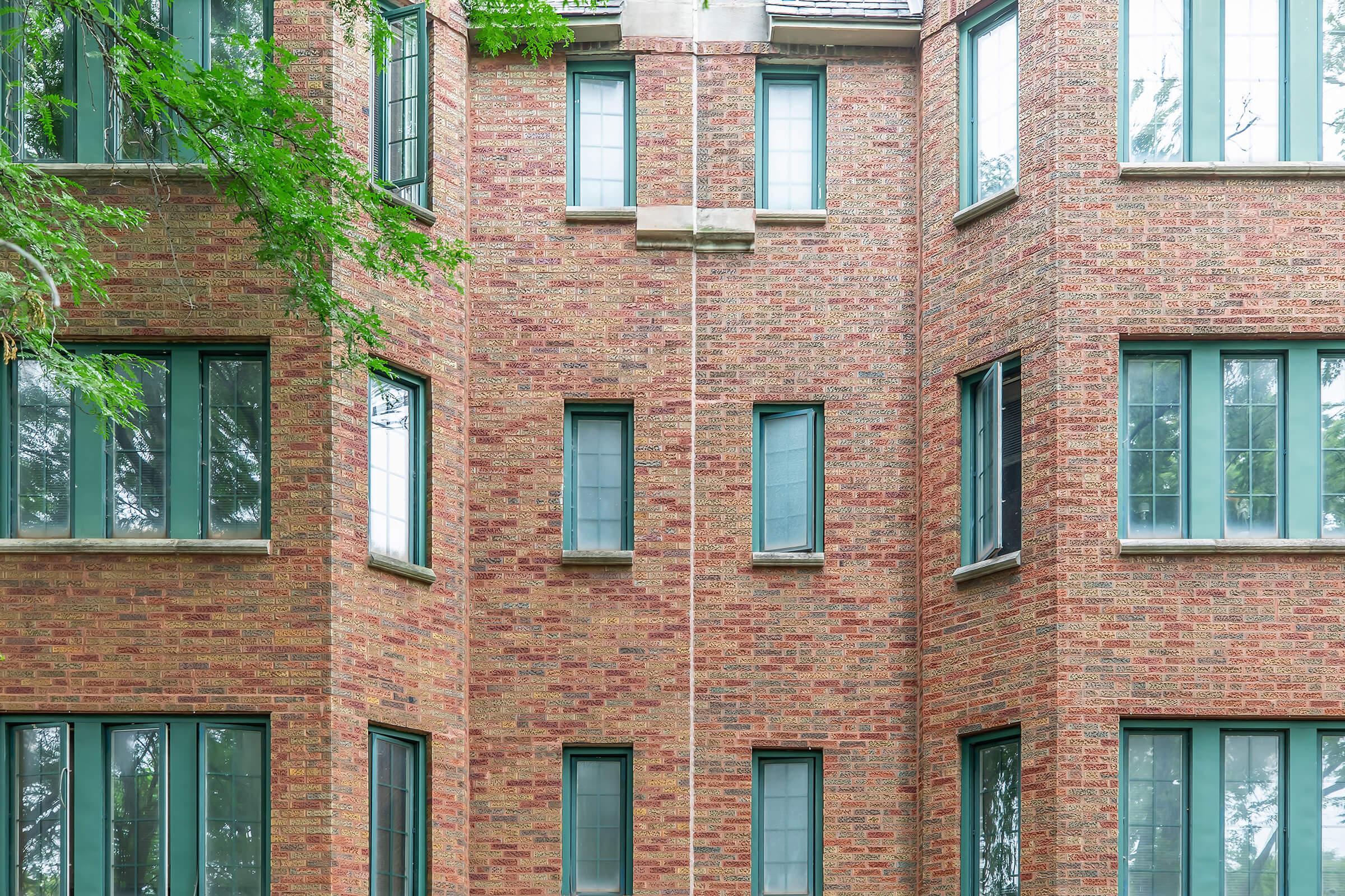 a large brick building with a store window