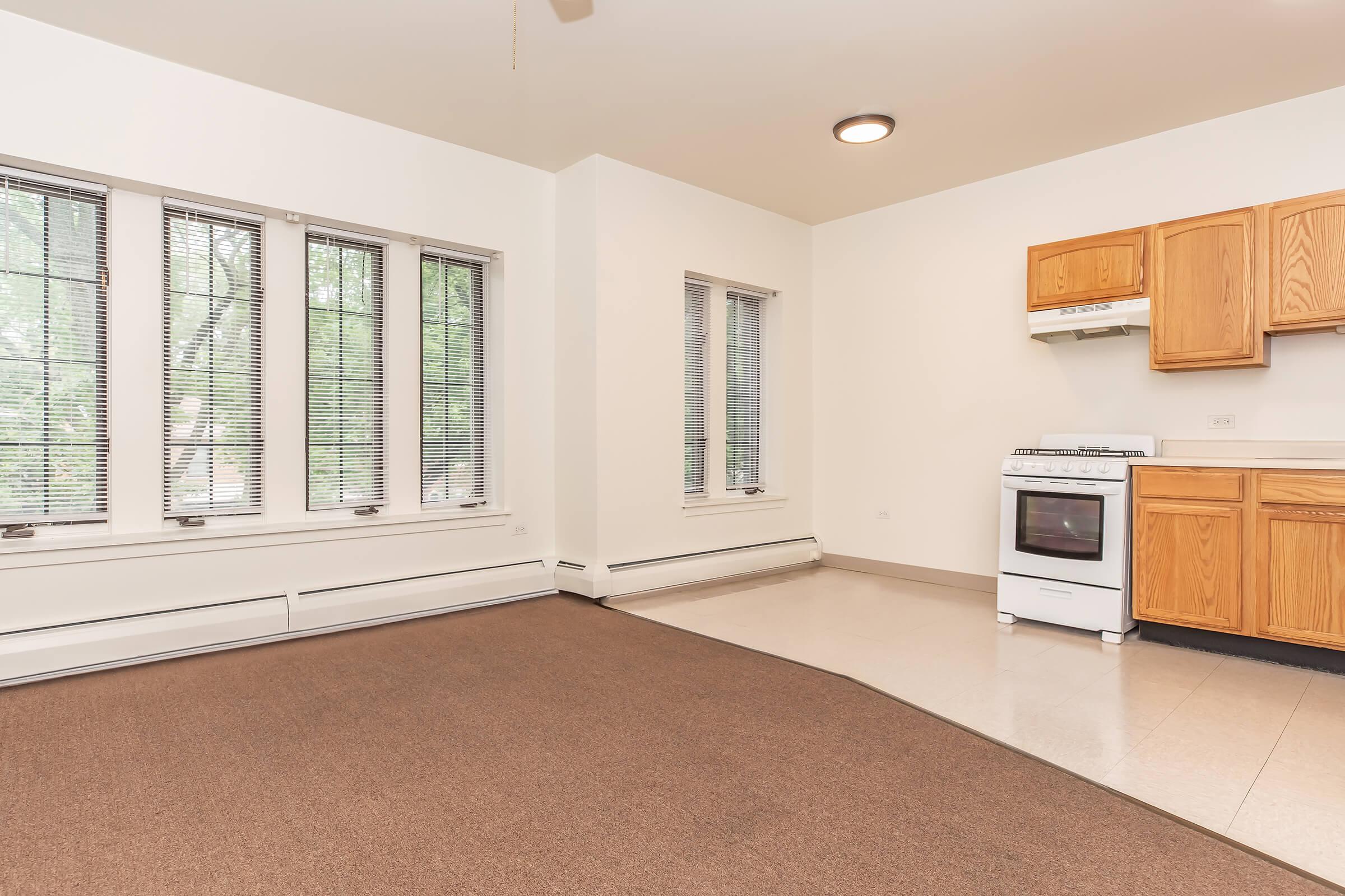 a kitchen area with a building in the background