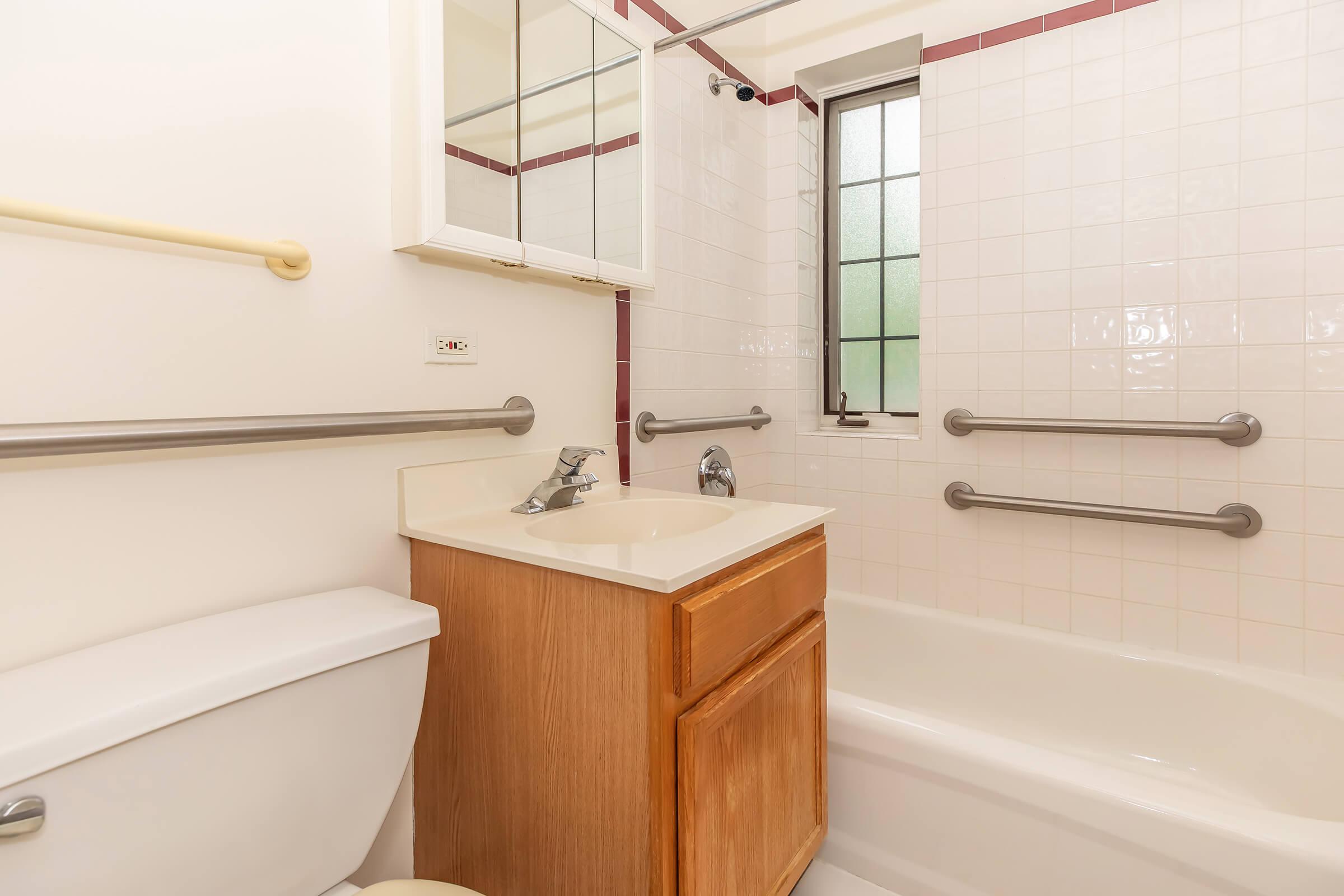 a close up of pink tub and sink