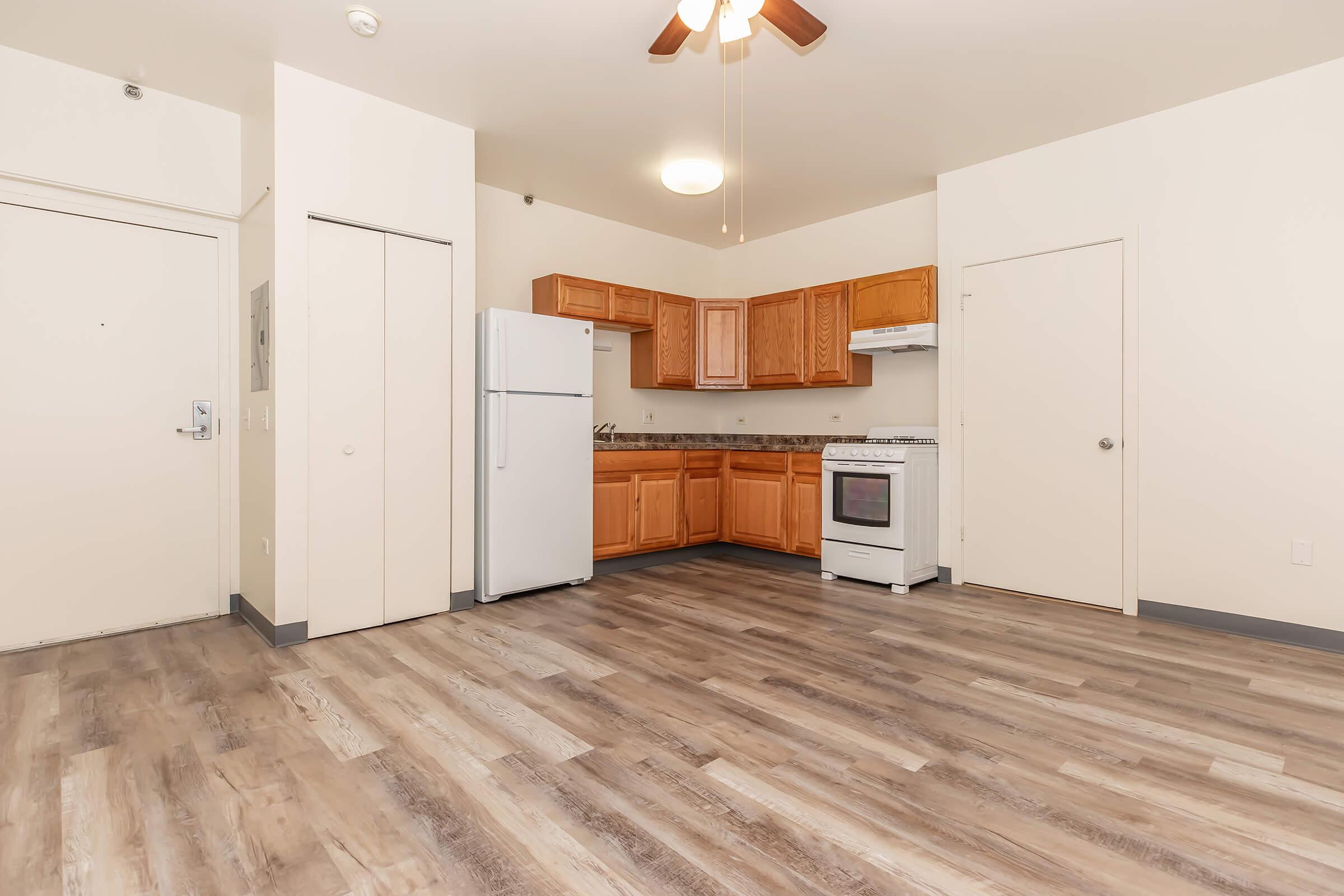 a kitchen with a wood floor