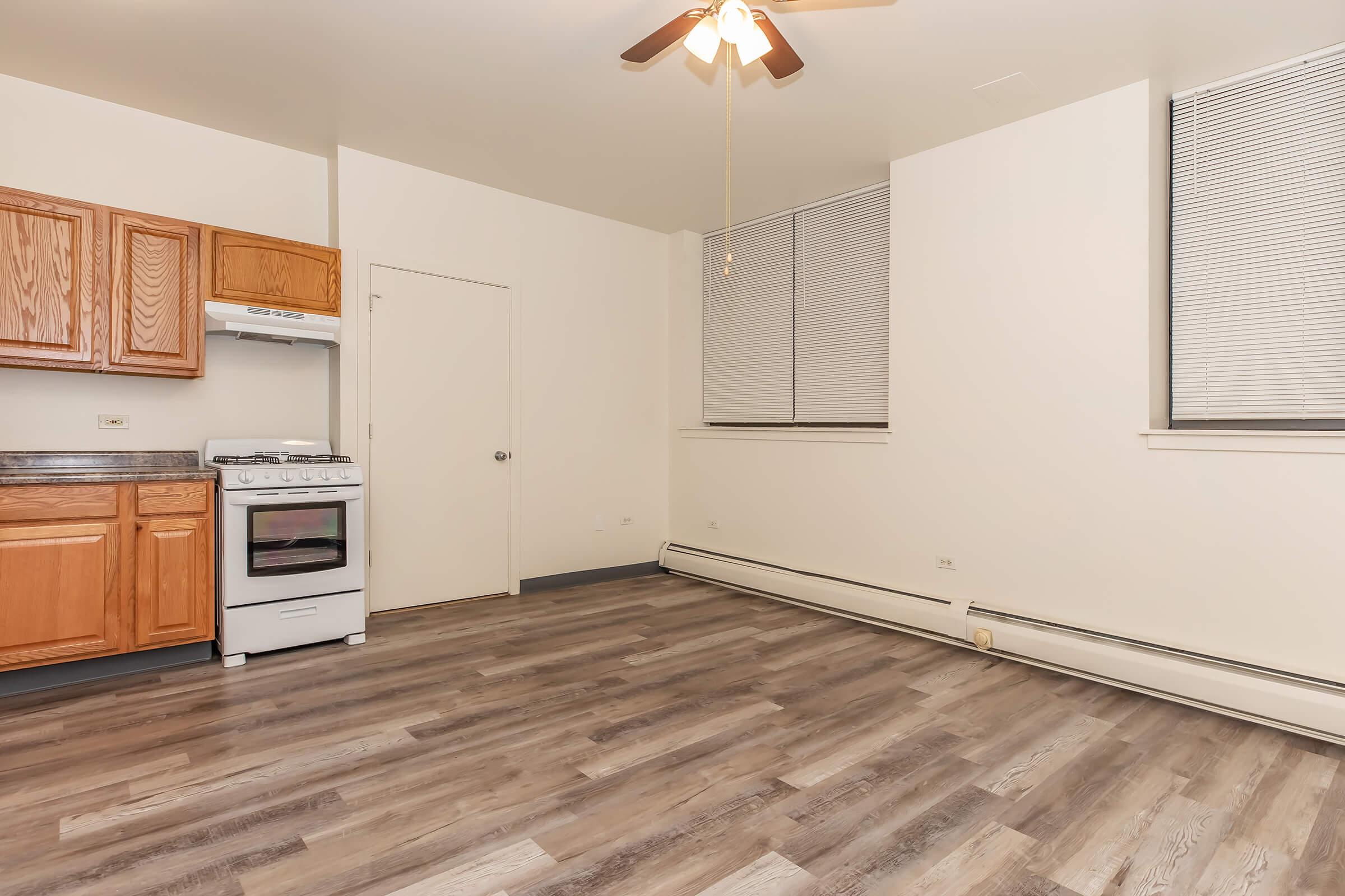 a kitchen with a wood floor