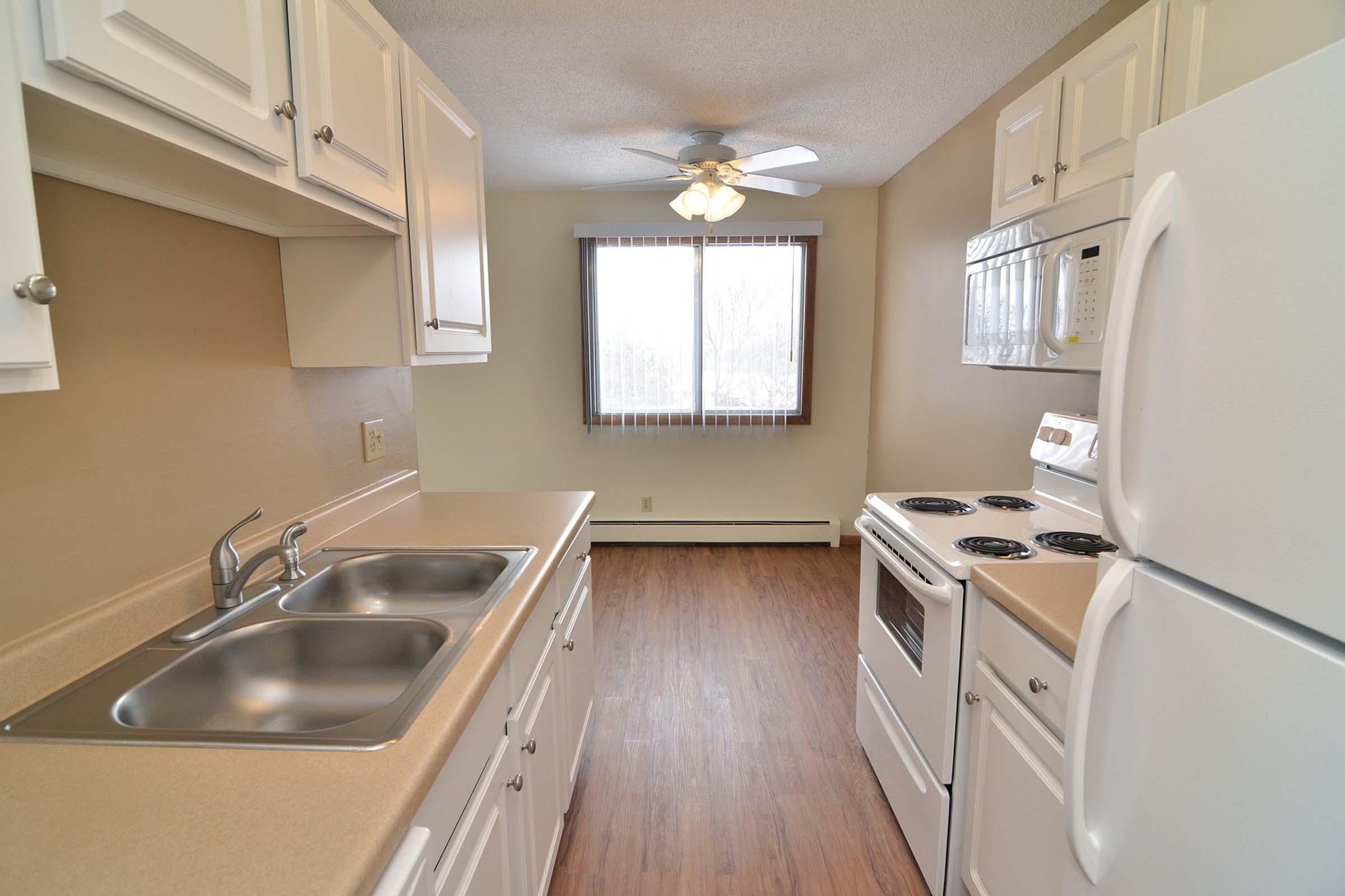 a kitchen with a stove and a sink