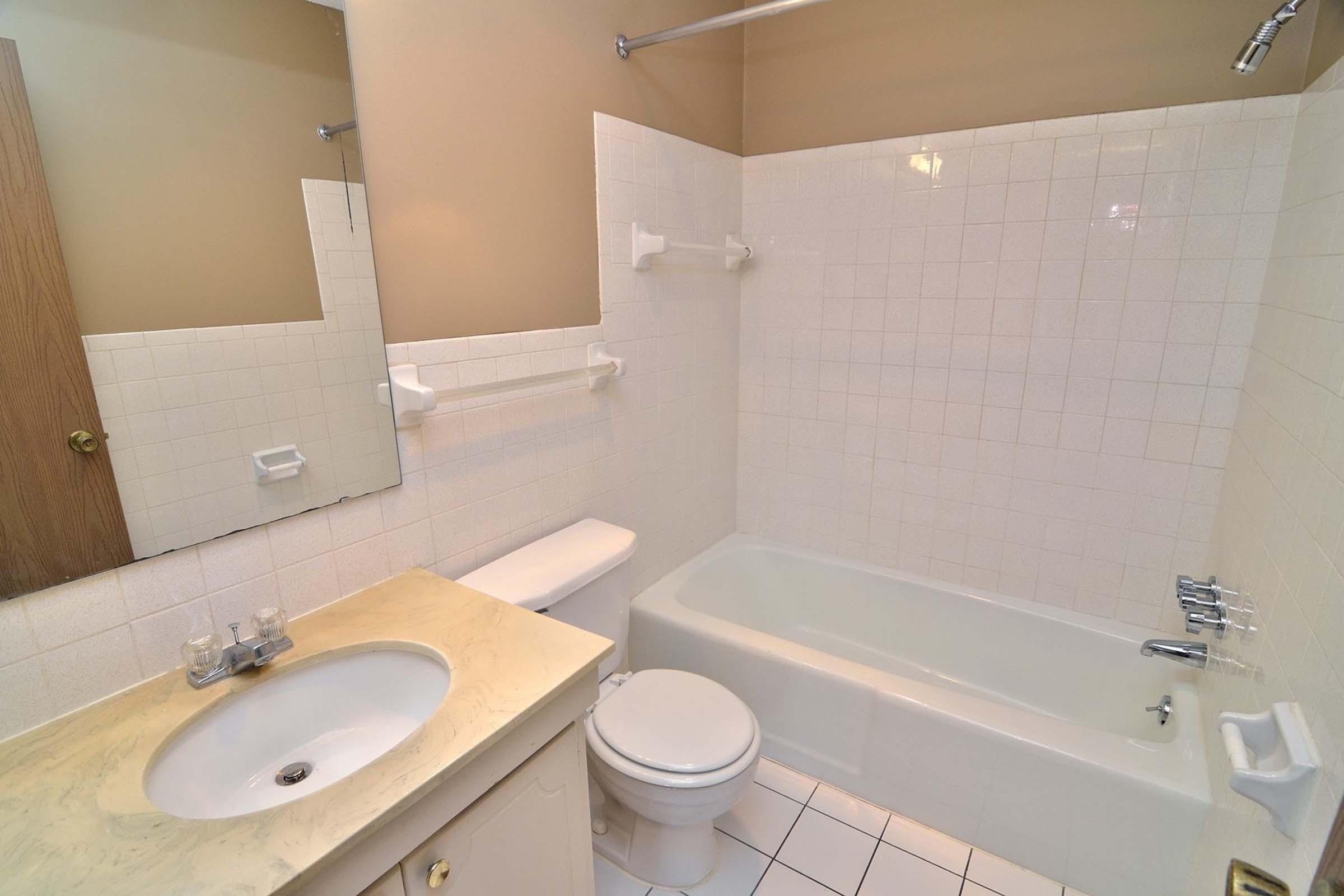 a restroom with a sink and a mirror