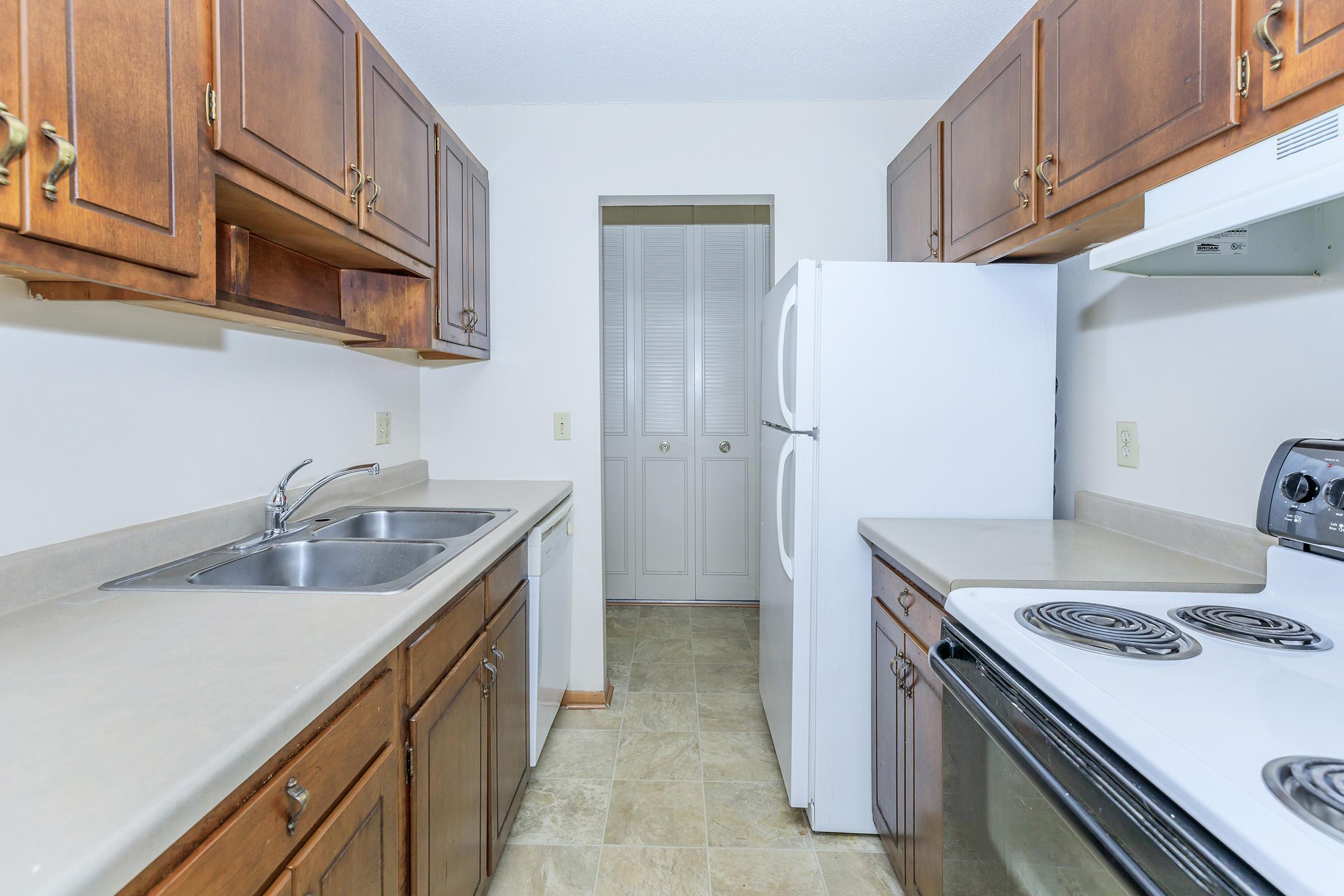 a kitchen with a stove top oven