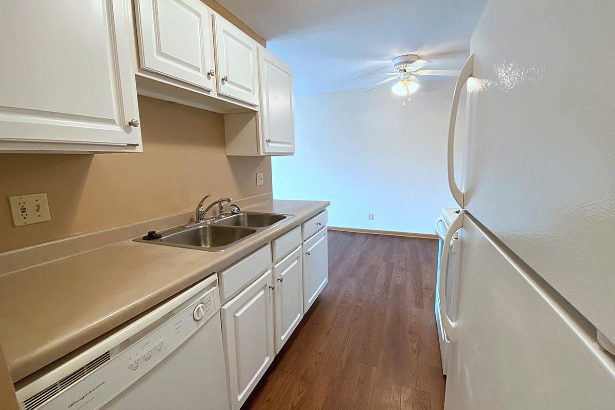 a stove top oven sitting inside of a kitchen