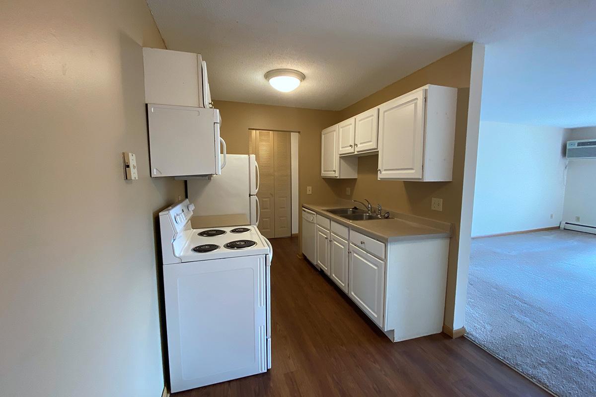 a kitchen with a stove and a refrigerator