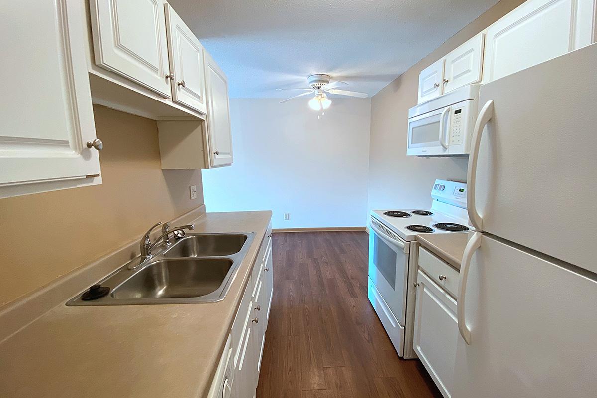 a kitchen with a stove and a sink