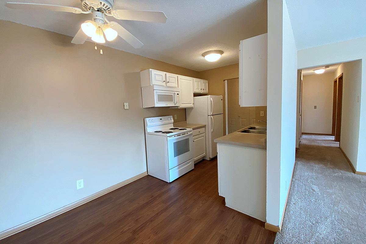 a kitchen with a wood floor