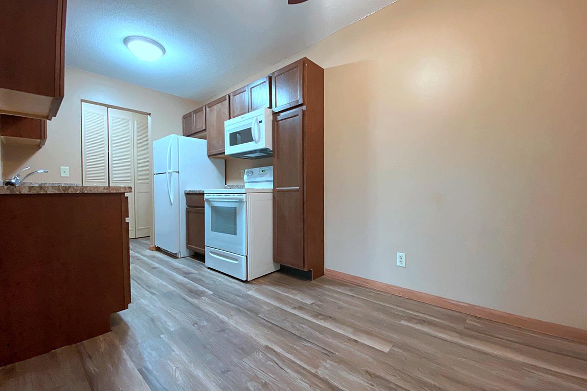 a large empty room with a wooden floor