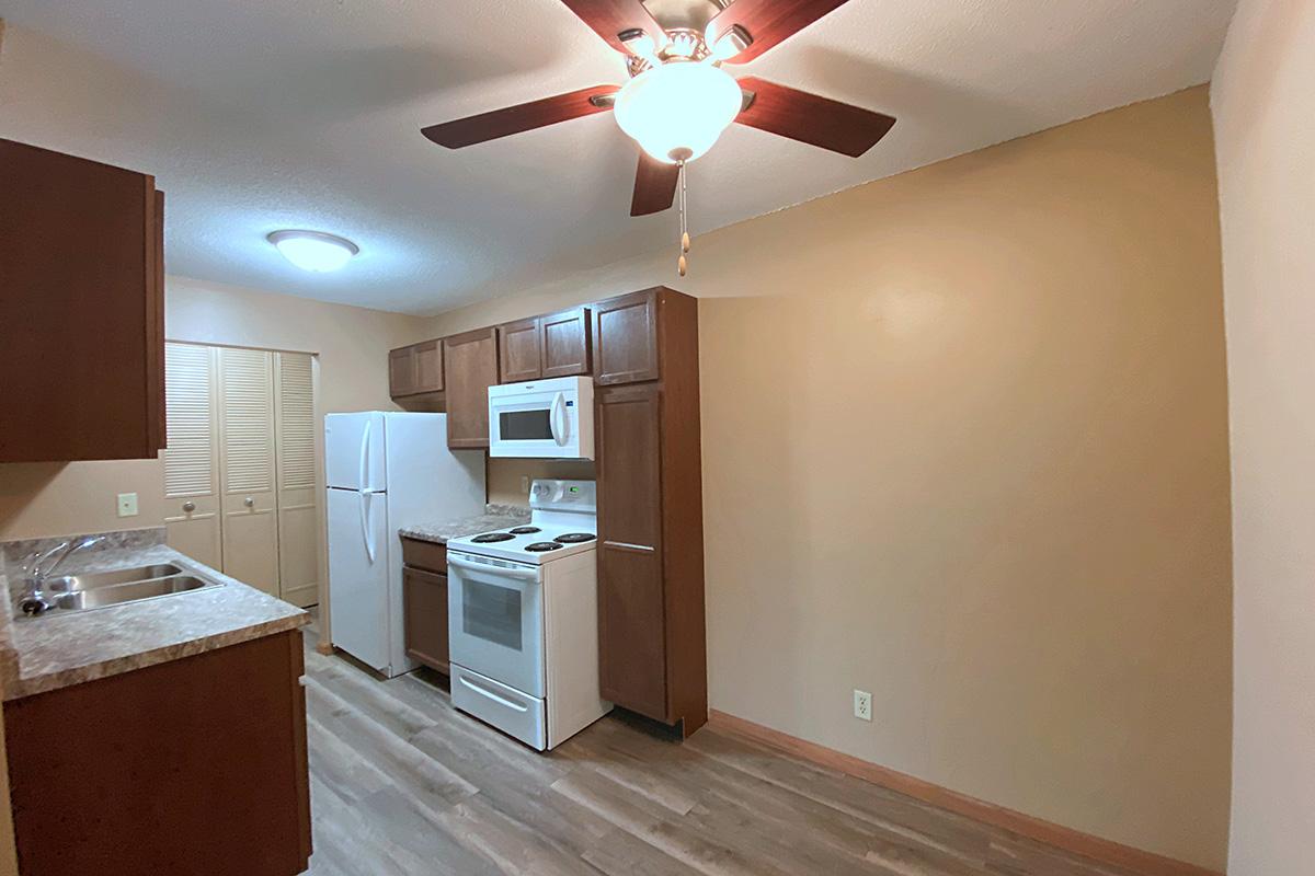 a kitchen with a sink and a refrigerator