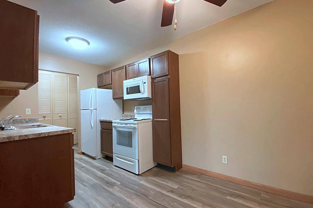 a kitchen with a sink and a refrigerator