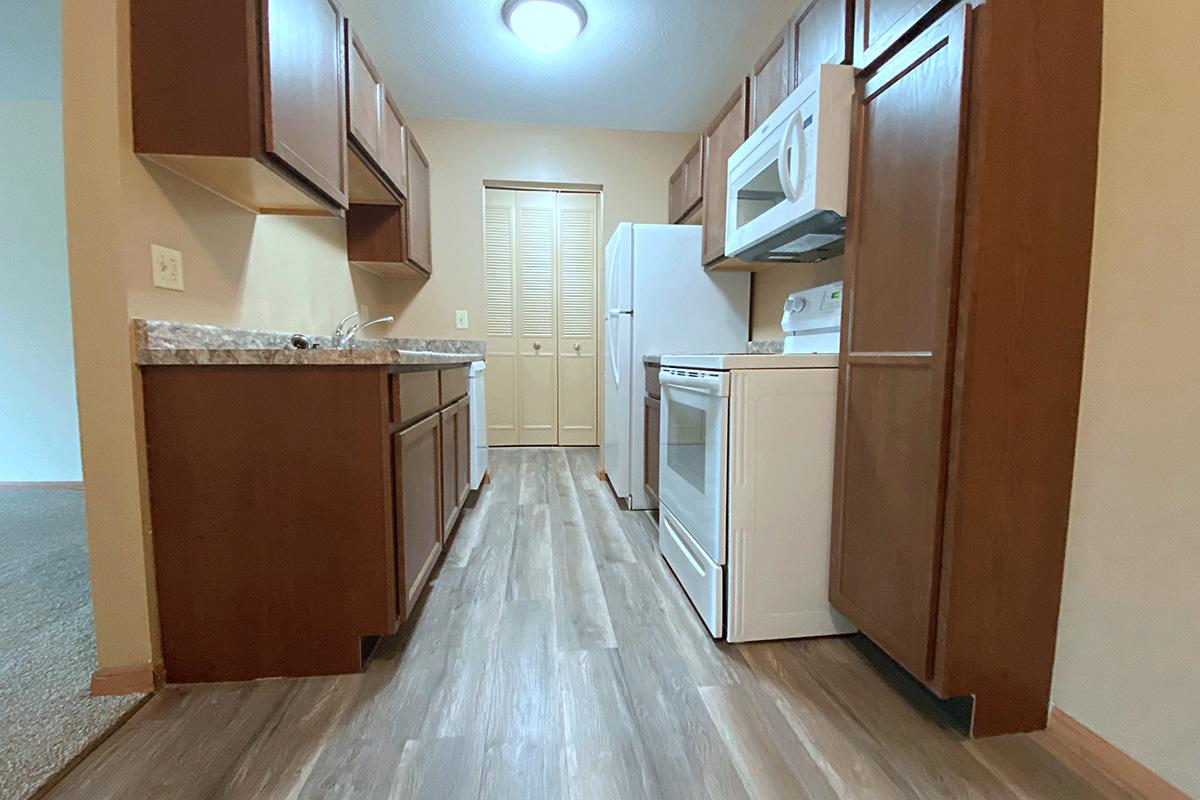 a kitchen with a wood floor