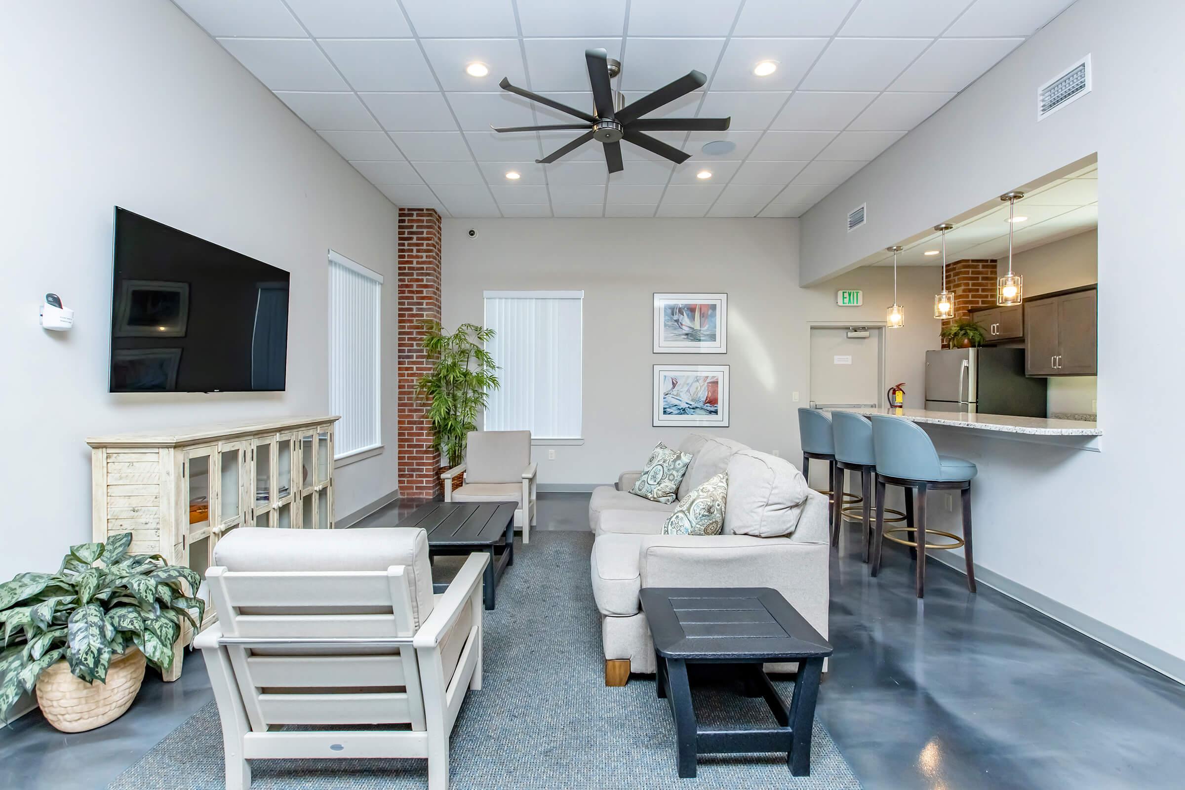 a living room filled with furniture and a fireplace