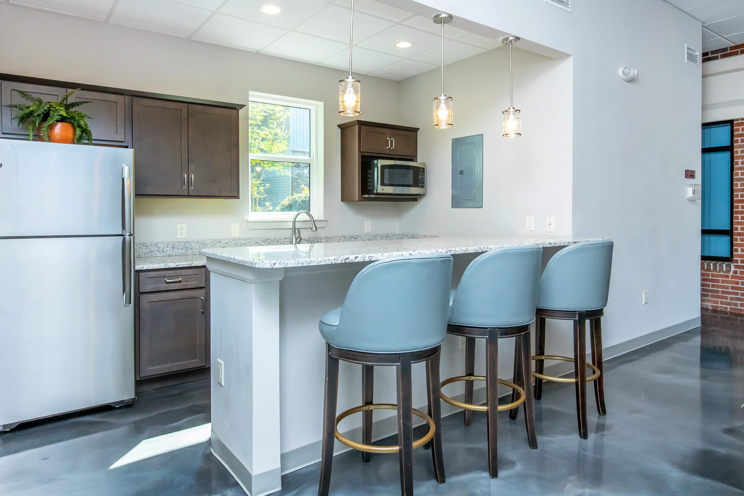 a kitchen with a dining room table