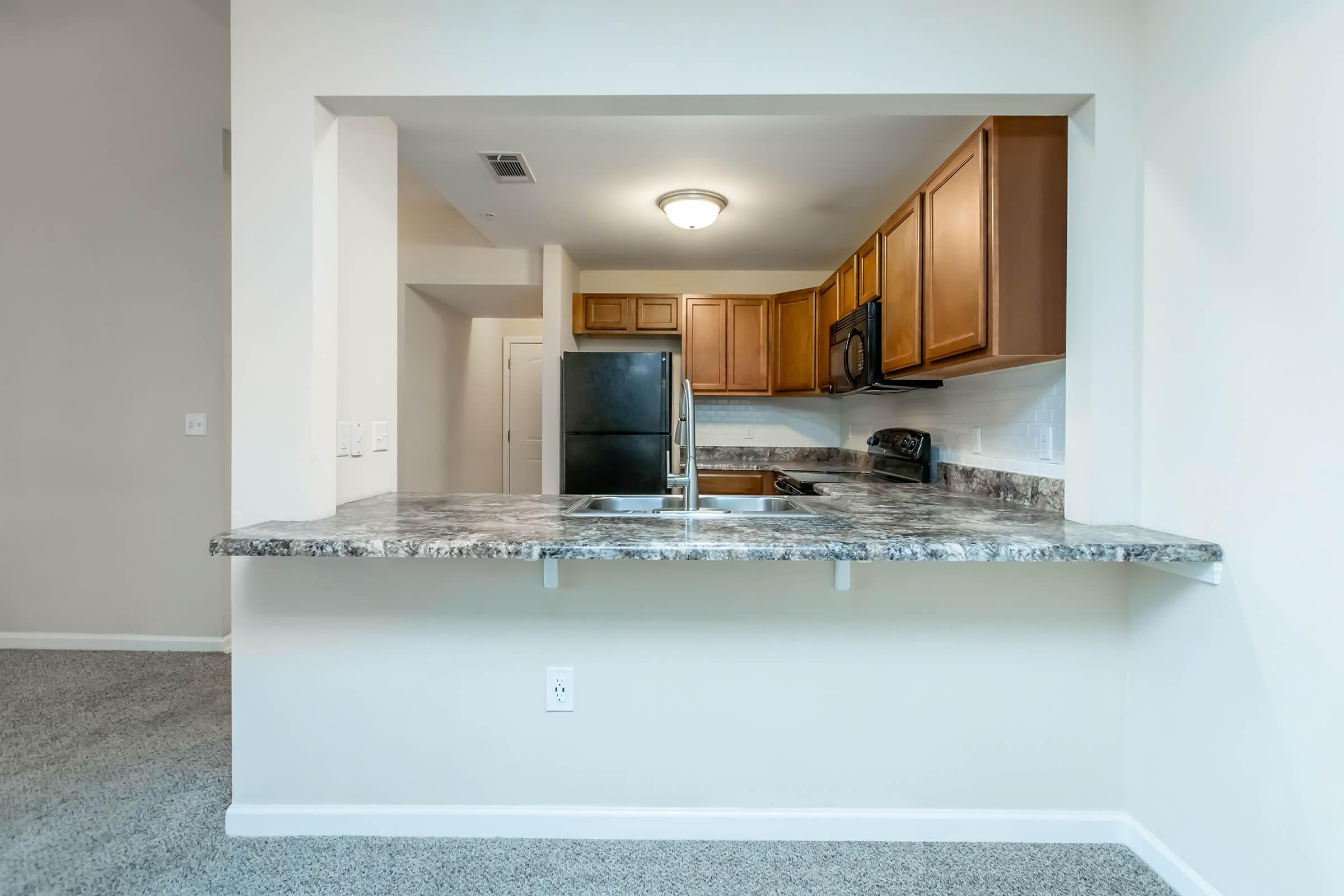 a kitchen with a sink and a microwave