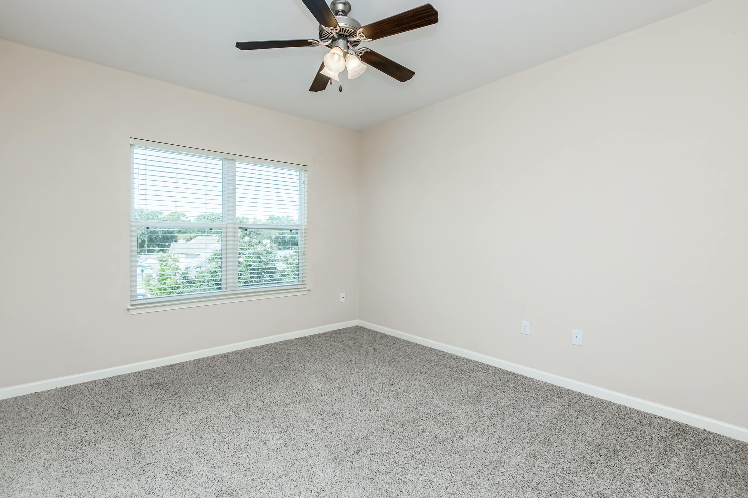 a bedroom with a large window