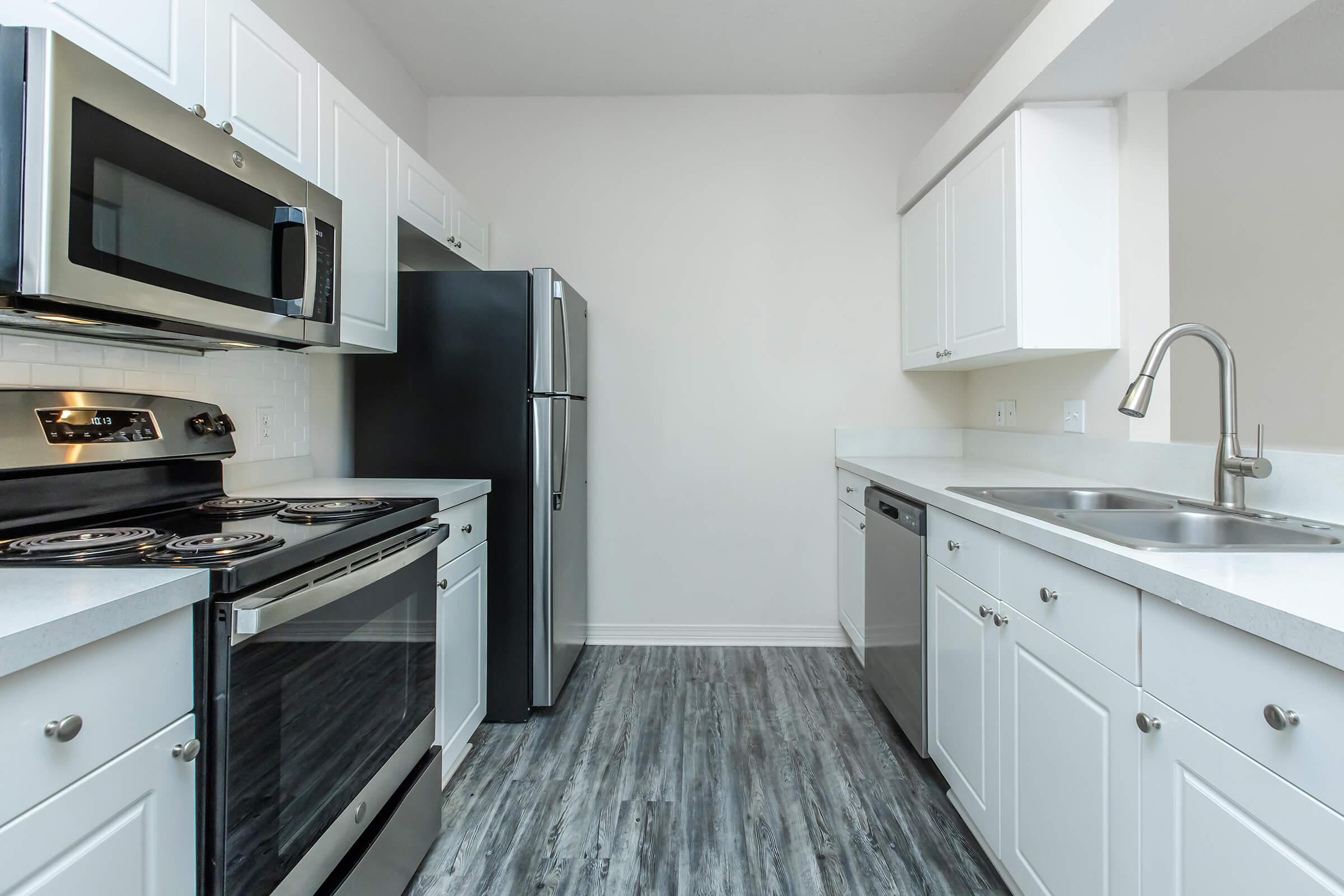 a kitchen with a stove and a sink