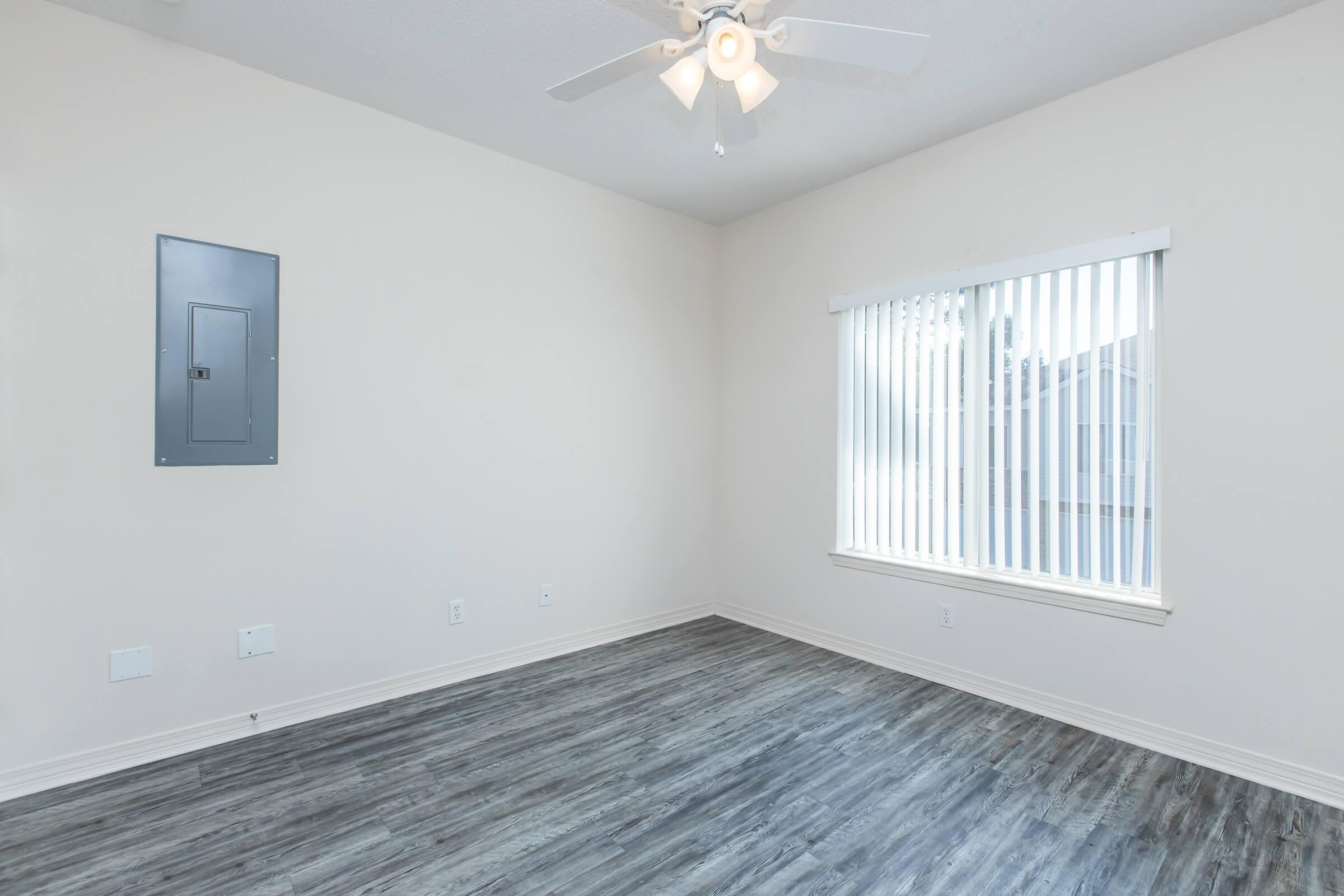 a bedroom with a large window