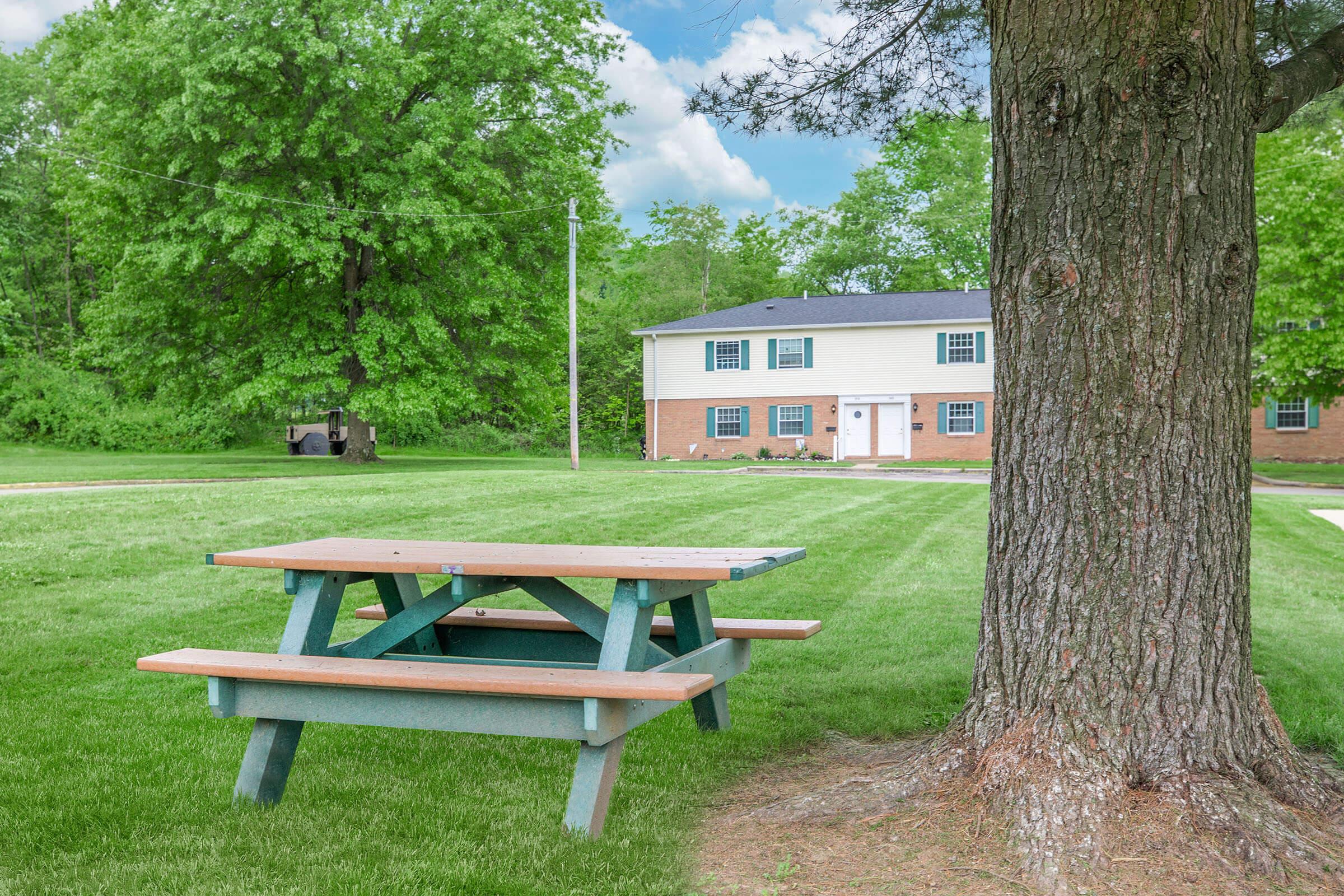 a wooden bench in a park