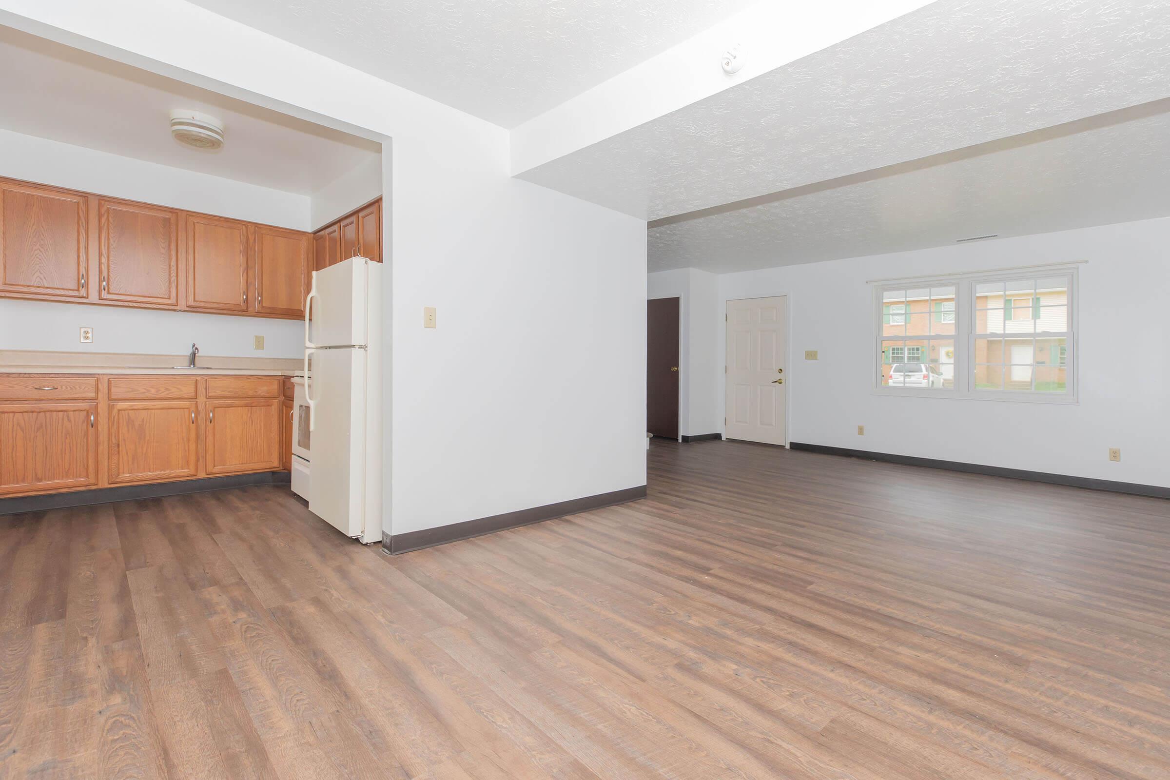 a kitchen with a wood floor