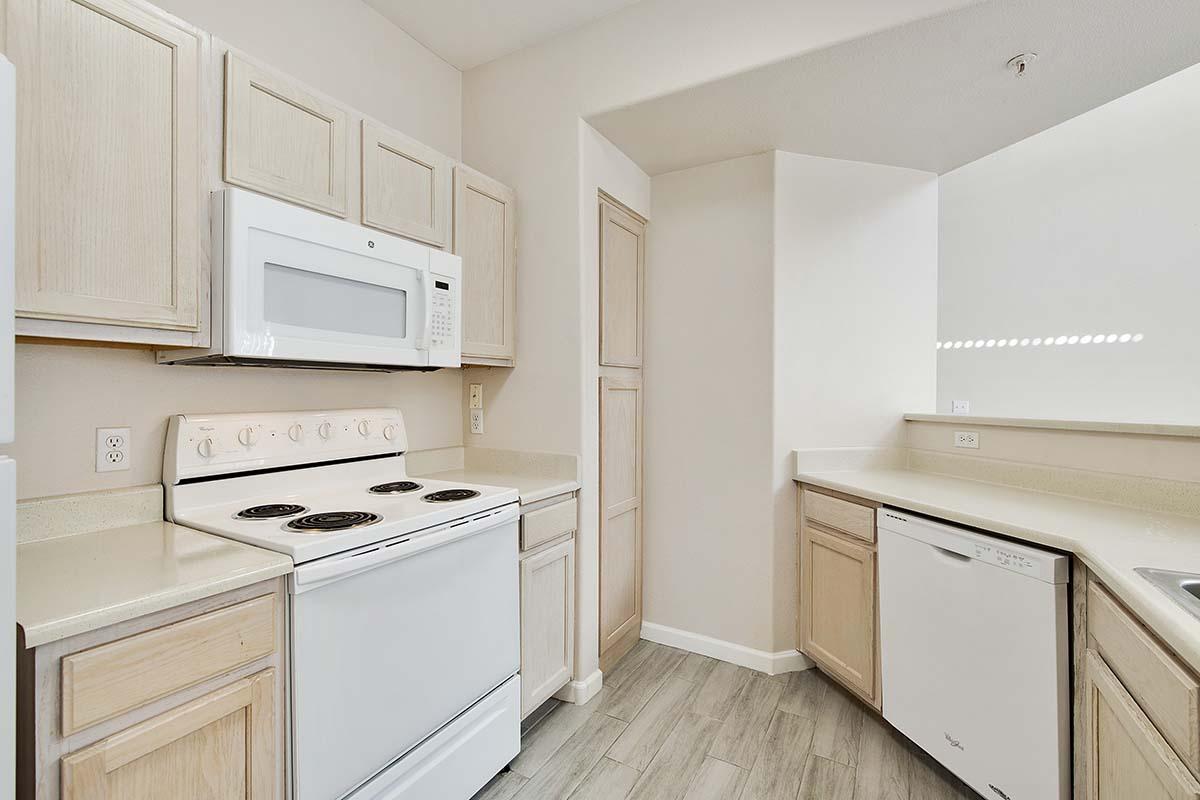 a kitchen with a refrigerator stove and microwave