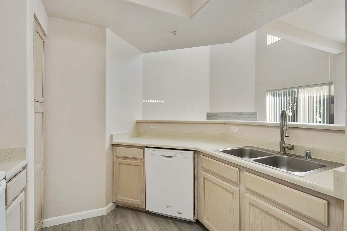 a kitchen with a sink and a window