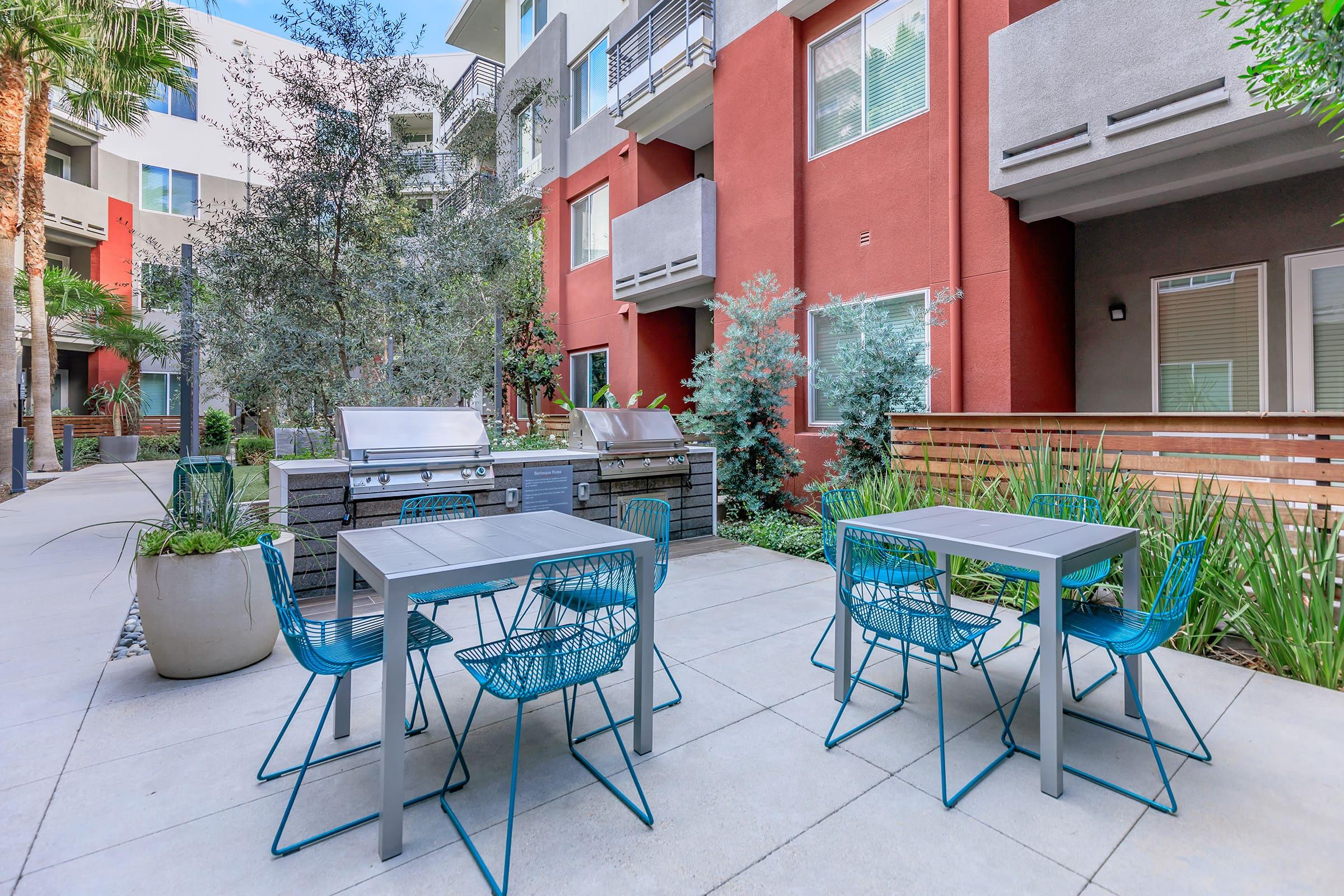 a couple of lawn chairs sitting on top of a building