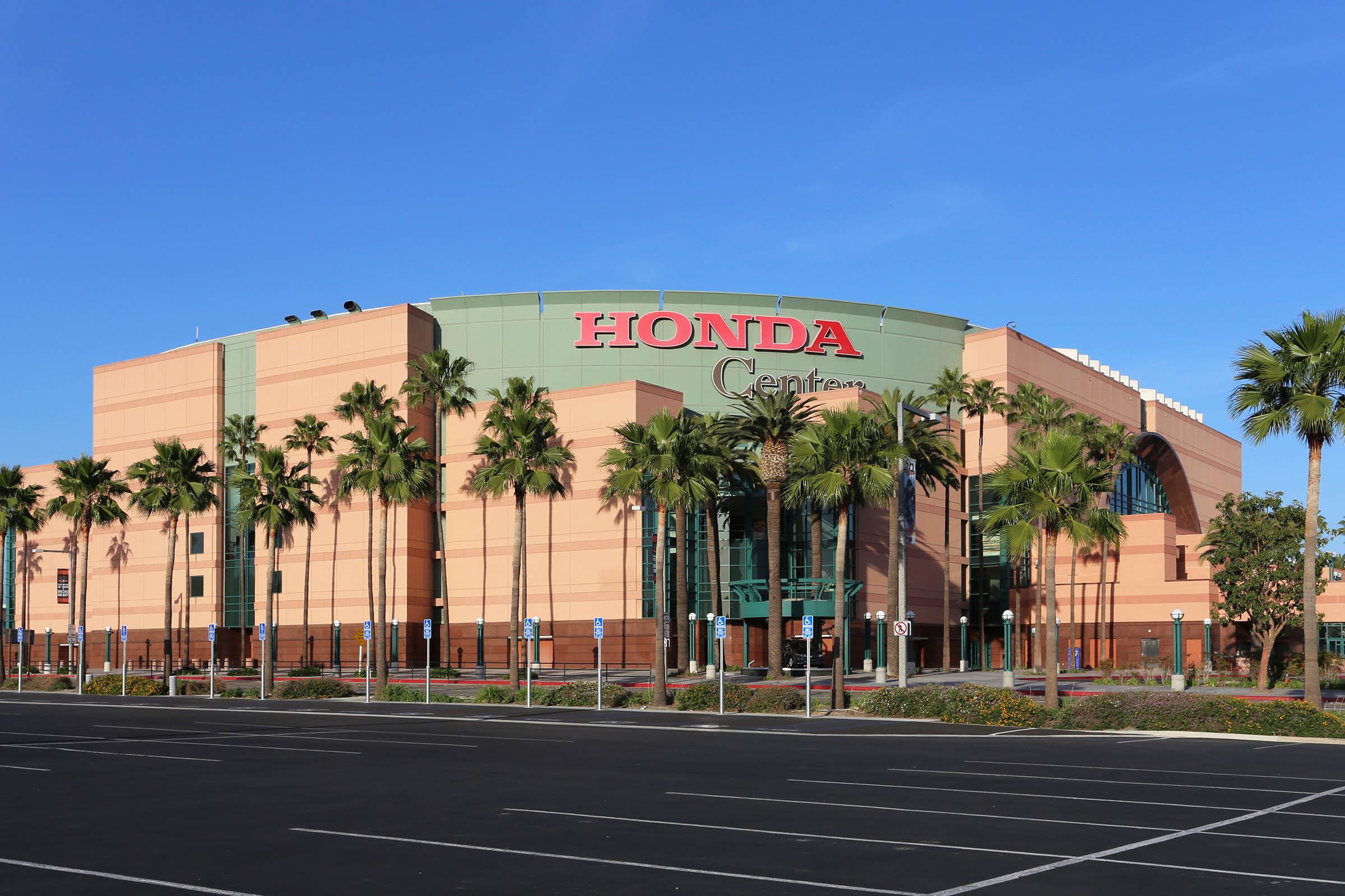 Honda Center that has a sign on the side of a road