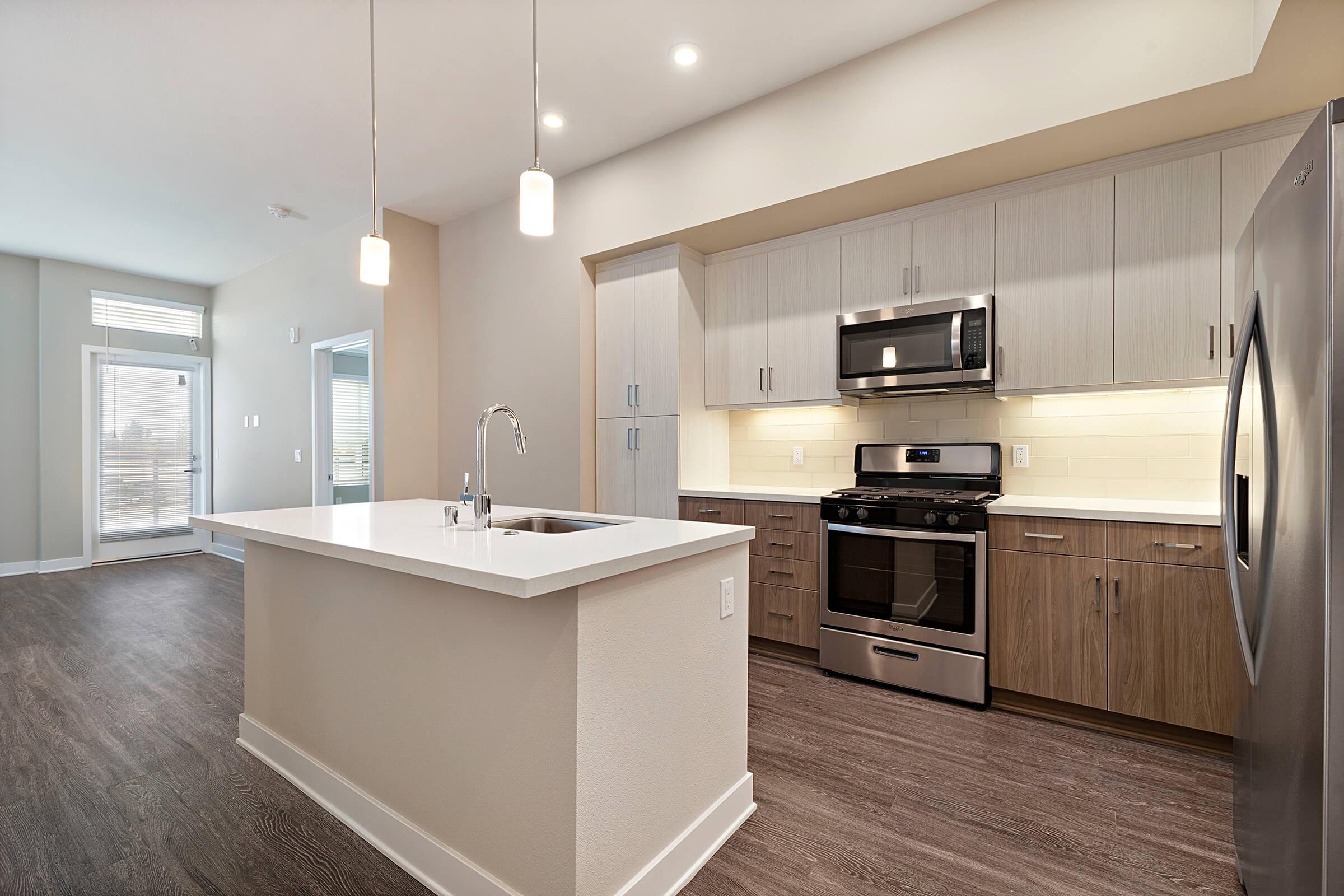 Kitchen with stainless steel appliances and an island