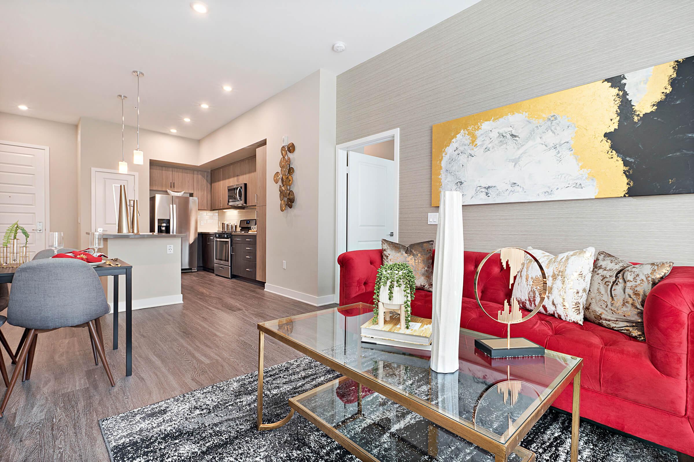 a living room filled with furniture and a rug